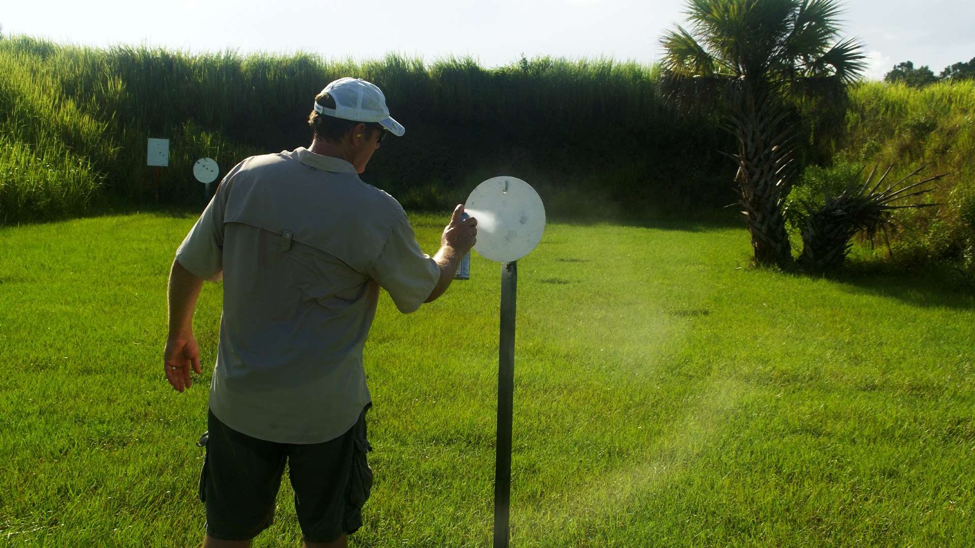 Steel challenge competitor spray painting a target