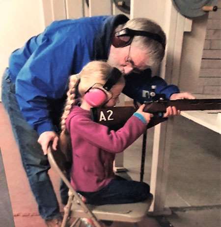 Juilan Beale passes on a lifetime of shooting experience to granddaughter Alexia.