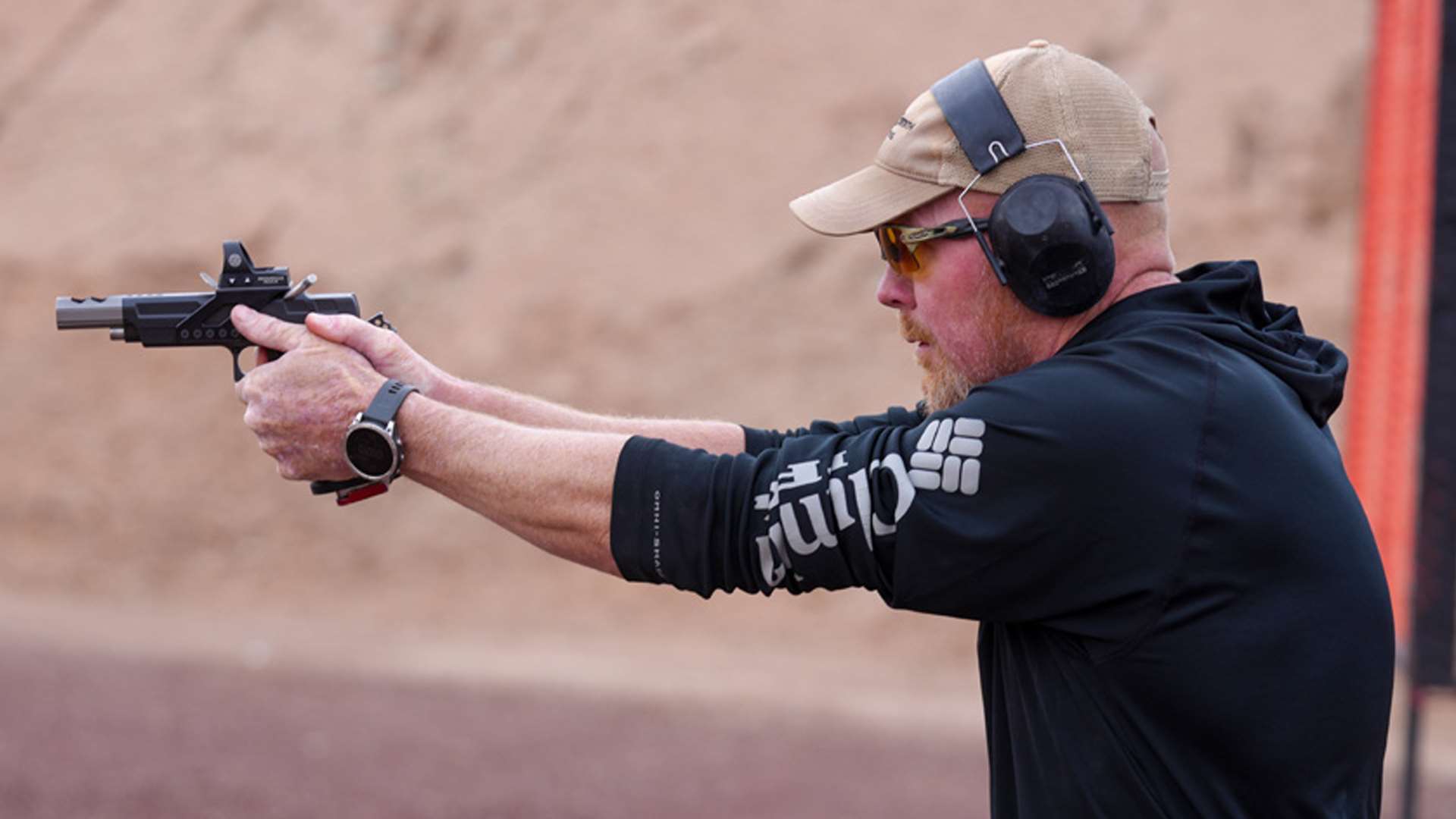 USPSA competitor Shannon Smith shoots on the move during a stage at the 2025 Race Gun Nationals in Hurricane, Utah