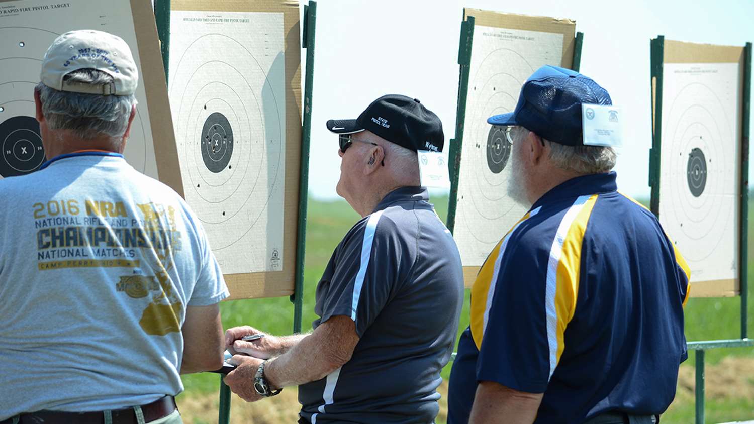 Gerald (center) has made regular trips to the National Matches since 1967.