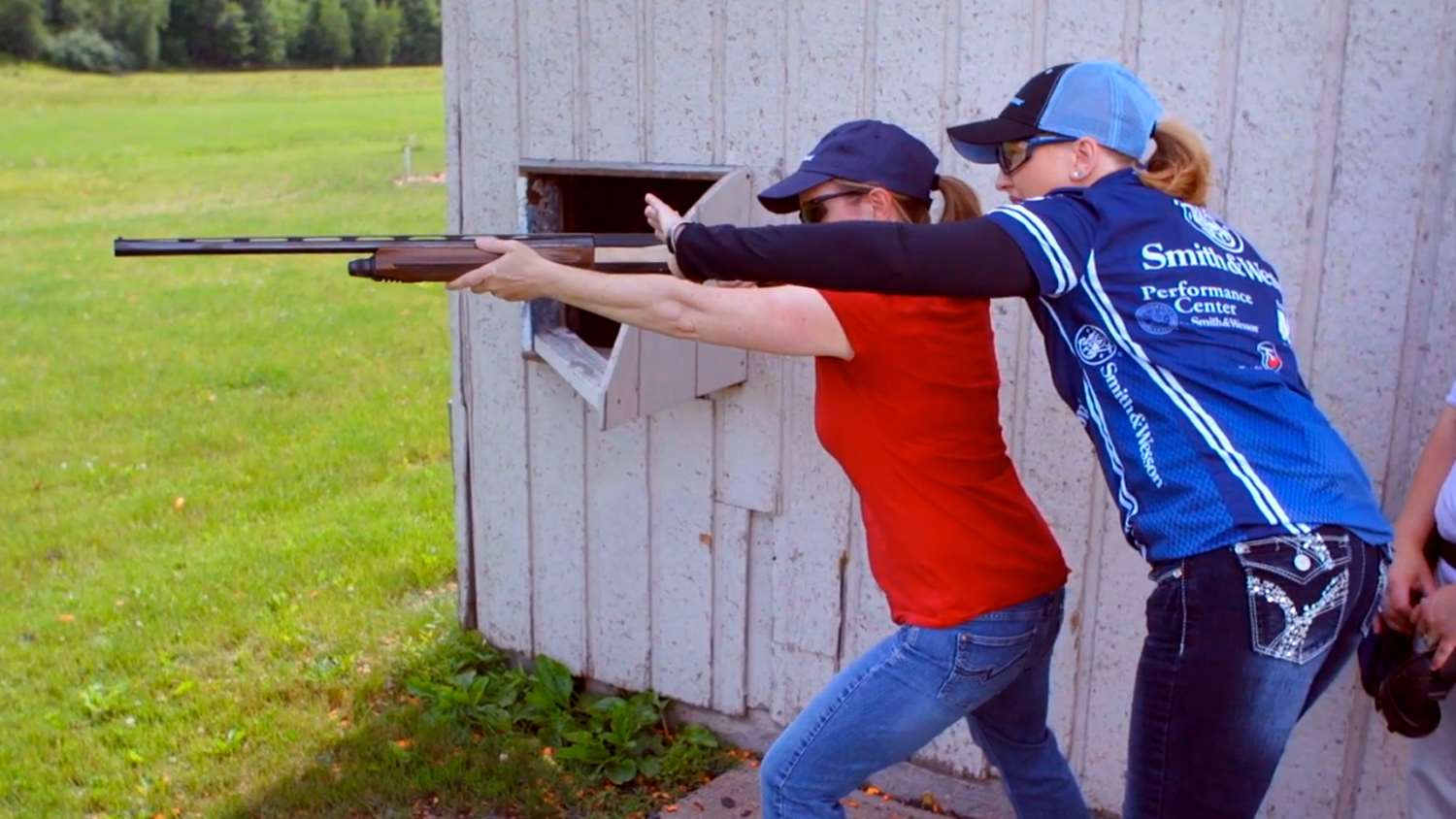 Julie Golob assisting a new shooter