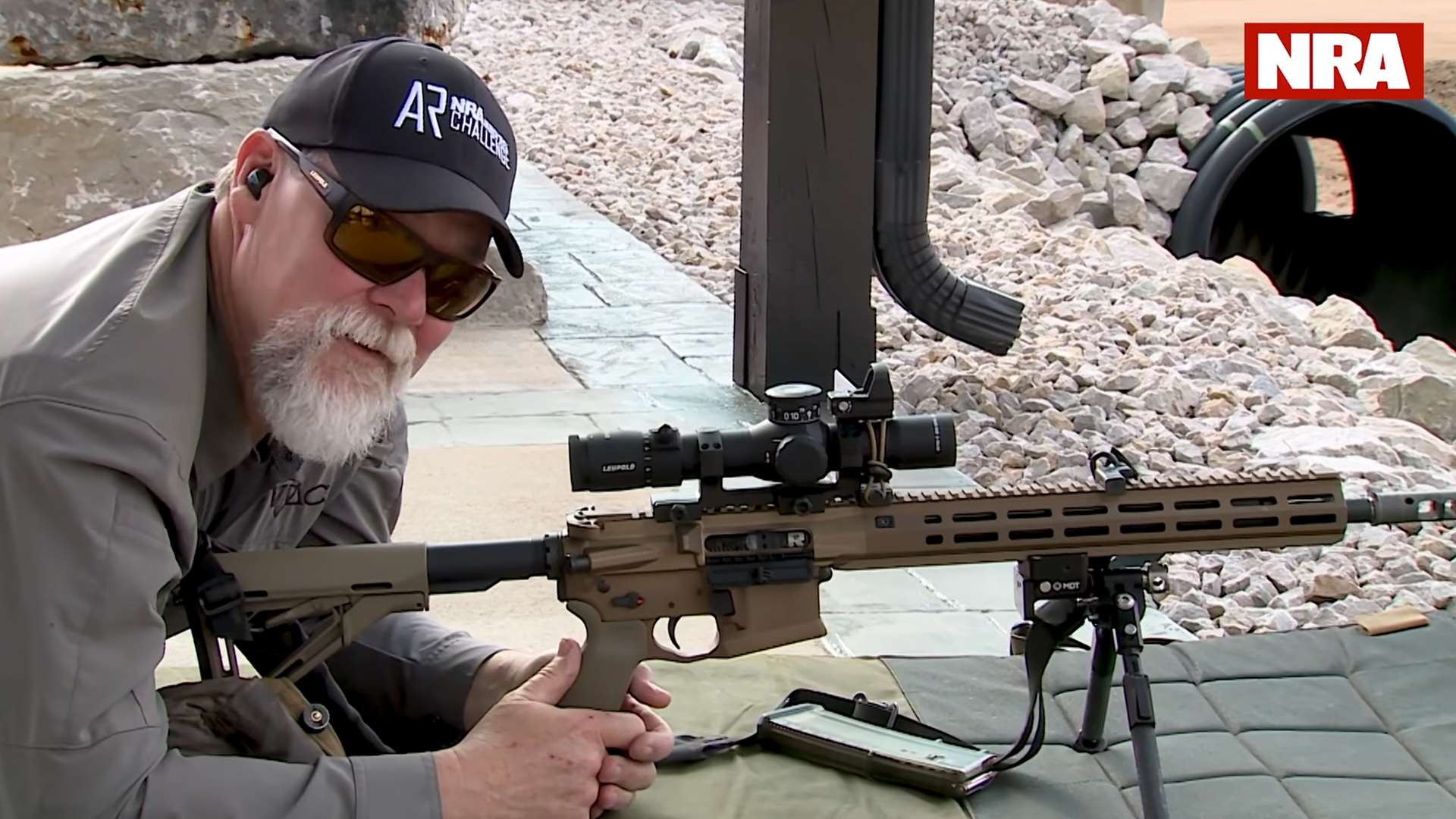 Kyle Lamb of Viking Tactics in prone position zeroing an AR-15 at 100 yards during NRA America’s Rifle Challenge instructional video on rifle zeroing