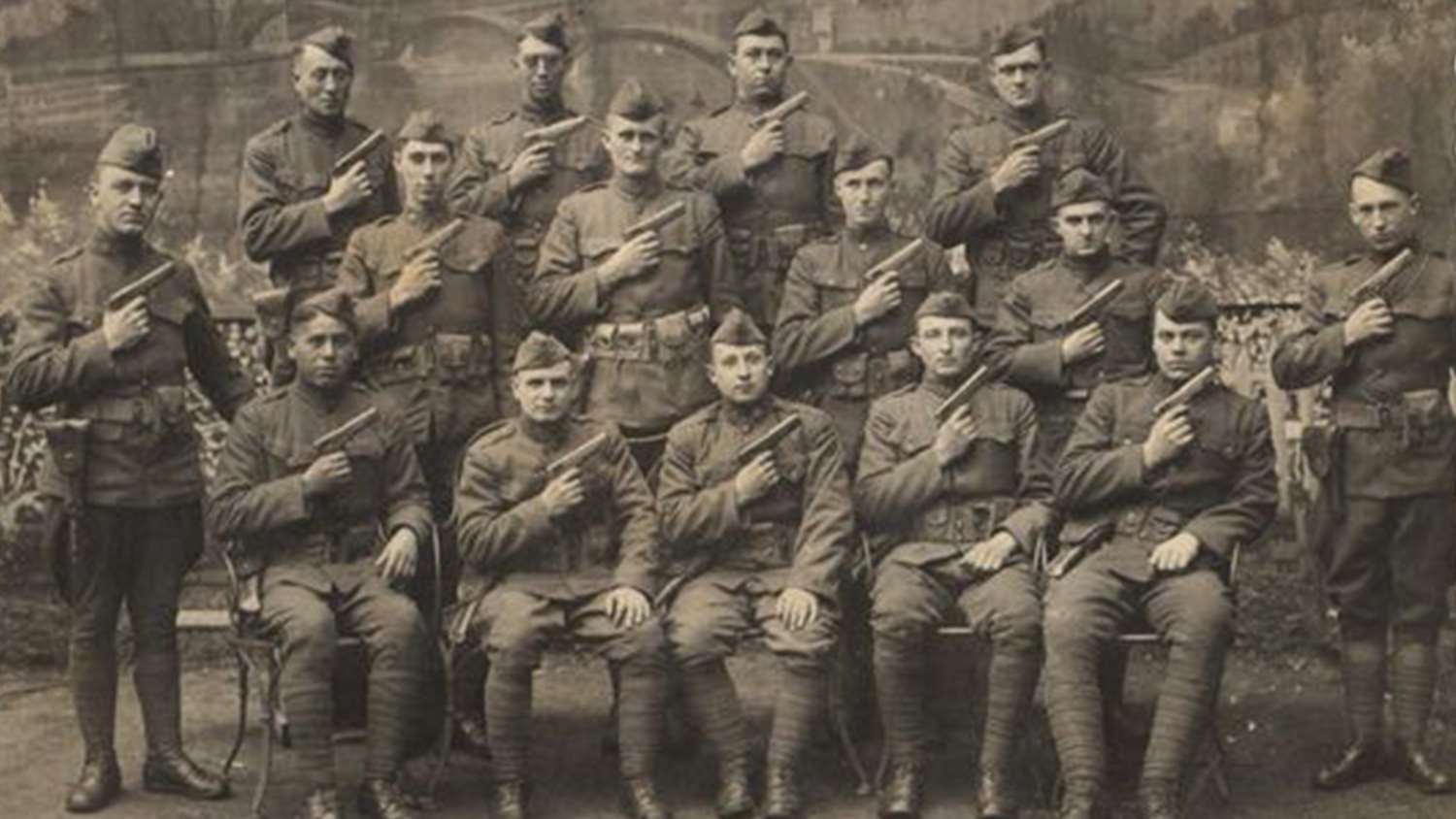 A battalion poses with their Colt M1911 pistols