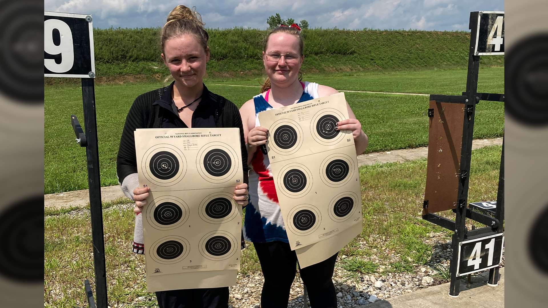 Gianna Albright and Aimee Ridinger with their targets at the NRA National Smallbore Rifle Three-Position Championship.