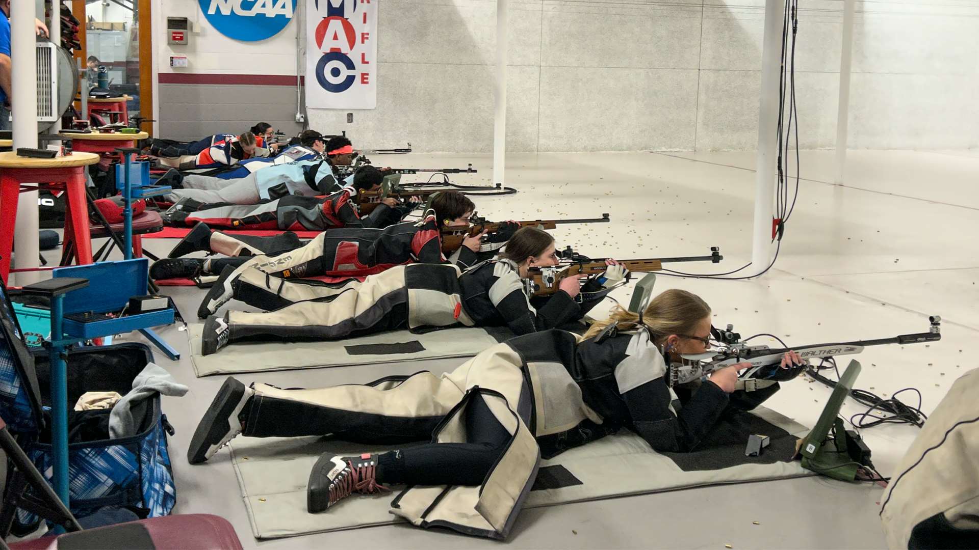 Collegiate rifle athletes fire from the prone position during the smallbore event at the 2026 Mid-Atlantic Rifle Conference Championship at MIT