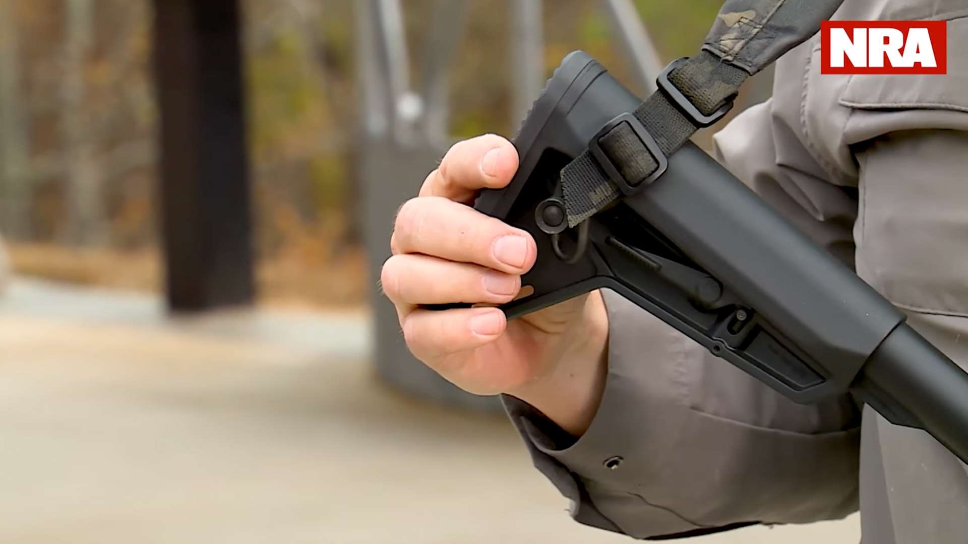 Rifle buttstock with sling attached on right side