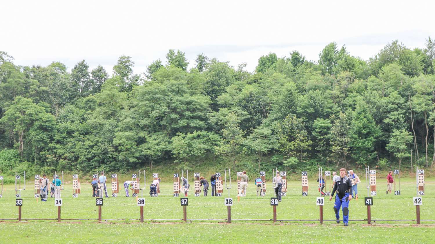 Smallbore shooters changing targets.