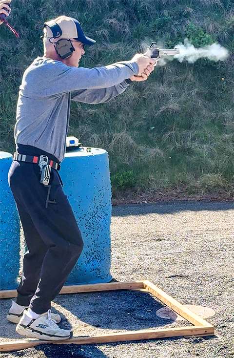 David Rotigel shoots his S&amp;W Model 986 revolver during a Steel Challenge stage