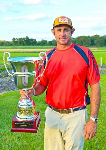 Anthony Matarese with North Central championship trophy