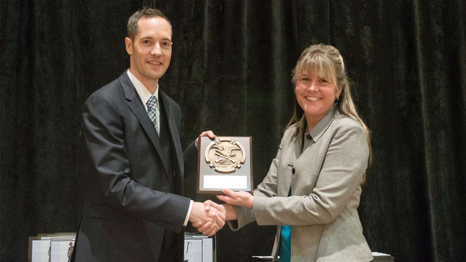Coach Jon Hammond receives NRA Distinguished Collegiate Coach Award