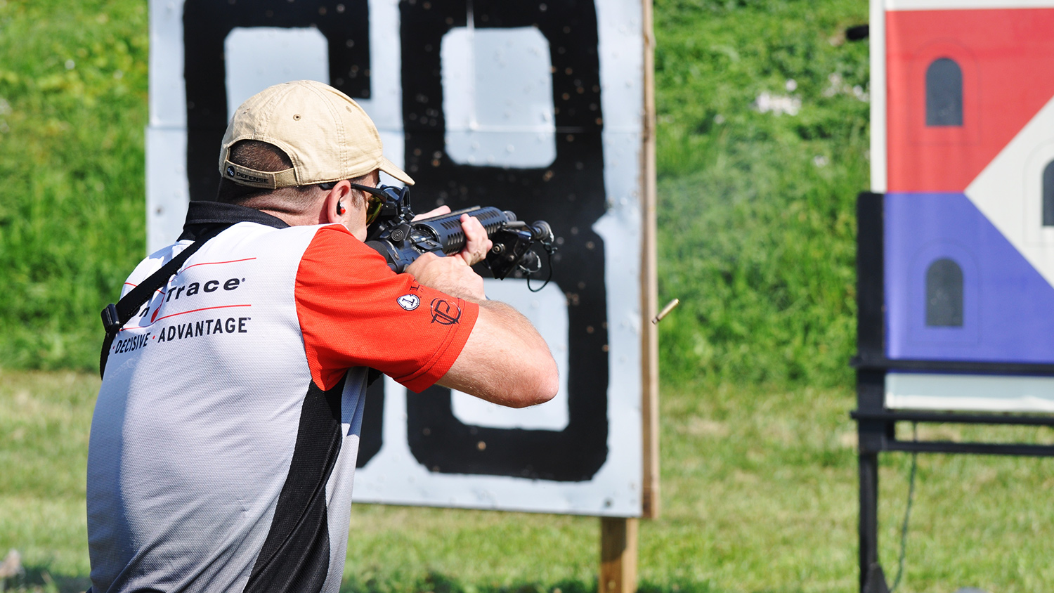Iain Harrison competes using an angled reflex sight and a higher magnification variable