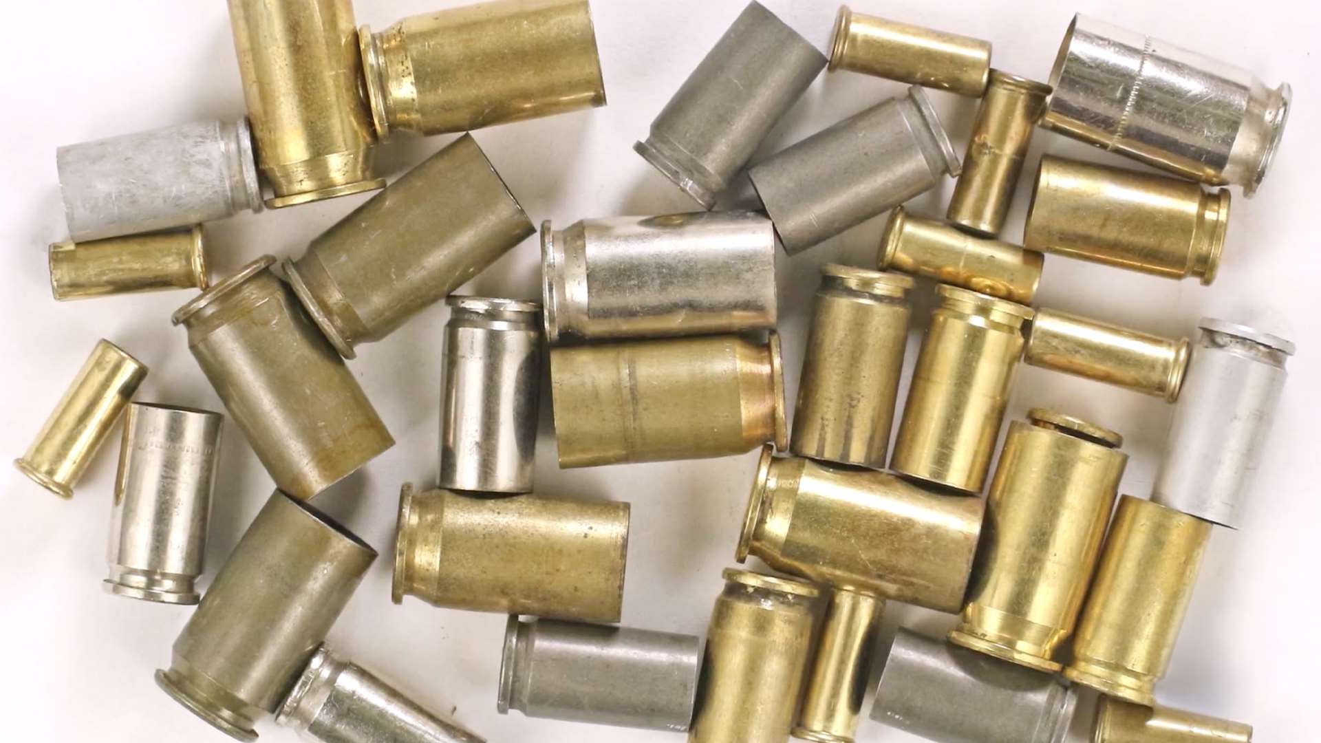 Close-up of cartridge cases showing the characteristic colors of the different materials used in most ammunition