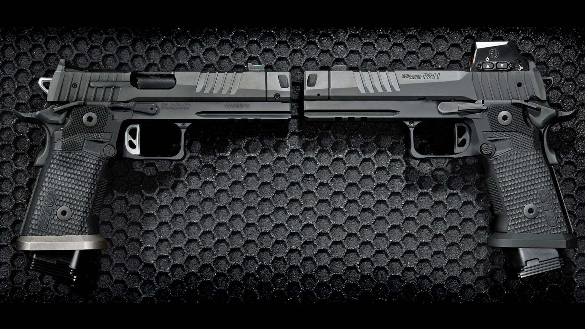 Two SIG Sauer P211-GTO 9mm handguns pictured muzzle to muzzle on a black background