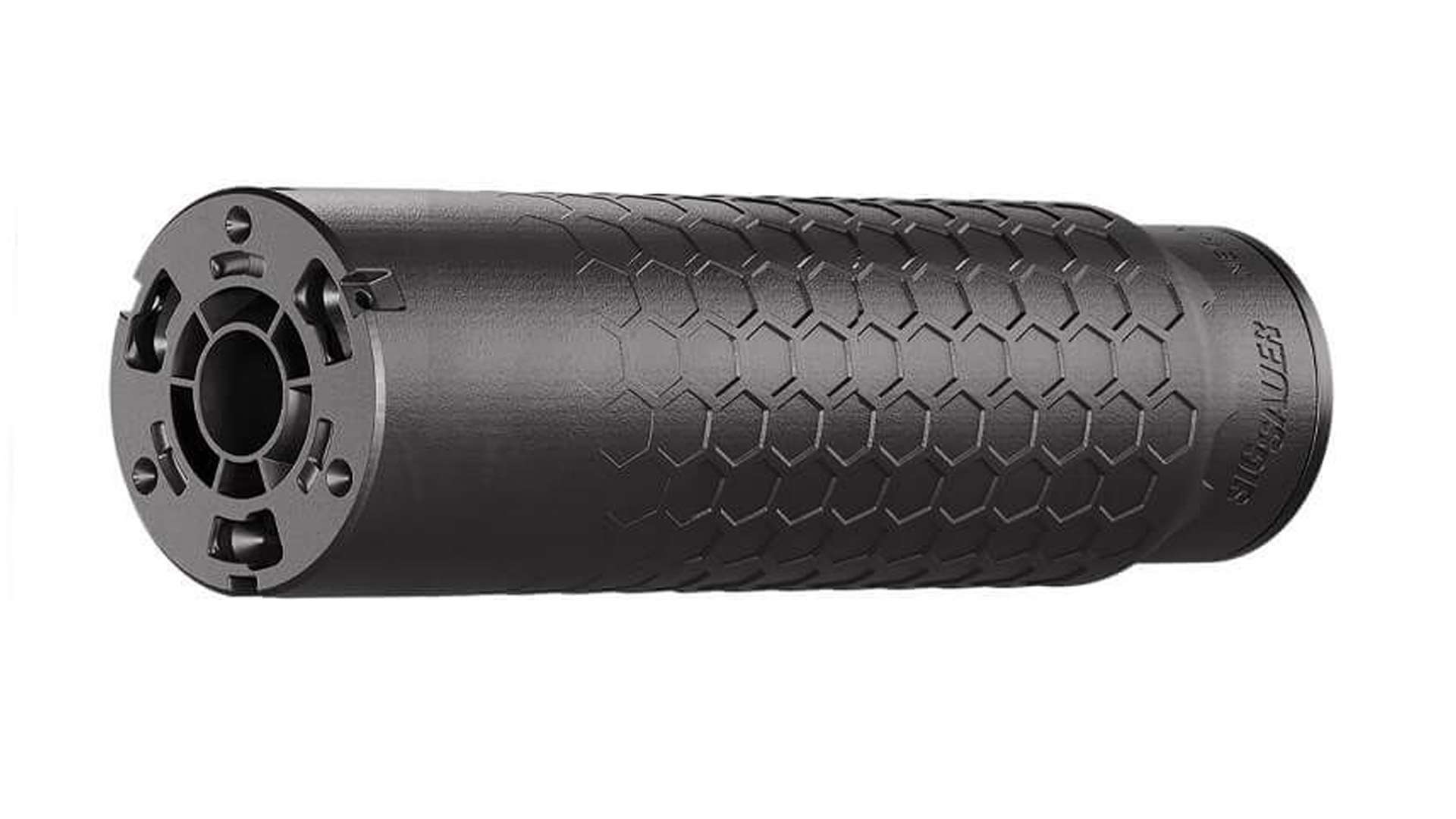 Black SIG Sauer Hexium556 rifle suppressor shown at an angle on a white background, with a hexagonal surface pattern along the tube and a slotted front end cap