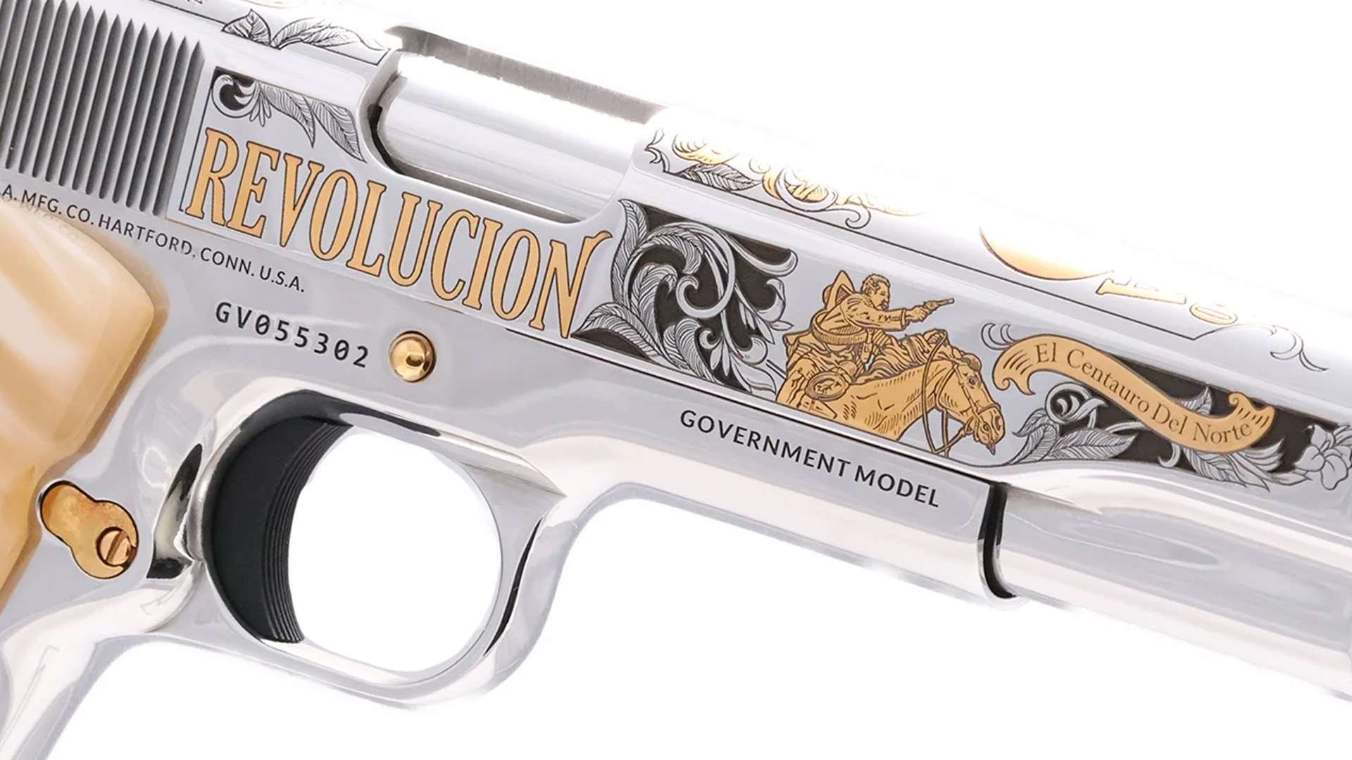 Close-up of an engraved 1911 slide reading REVOLUCION with a gold figure on horseback and a scroll banner