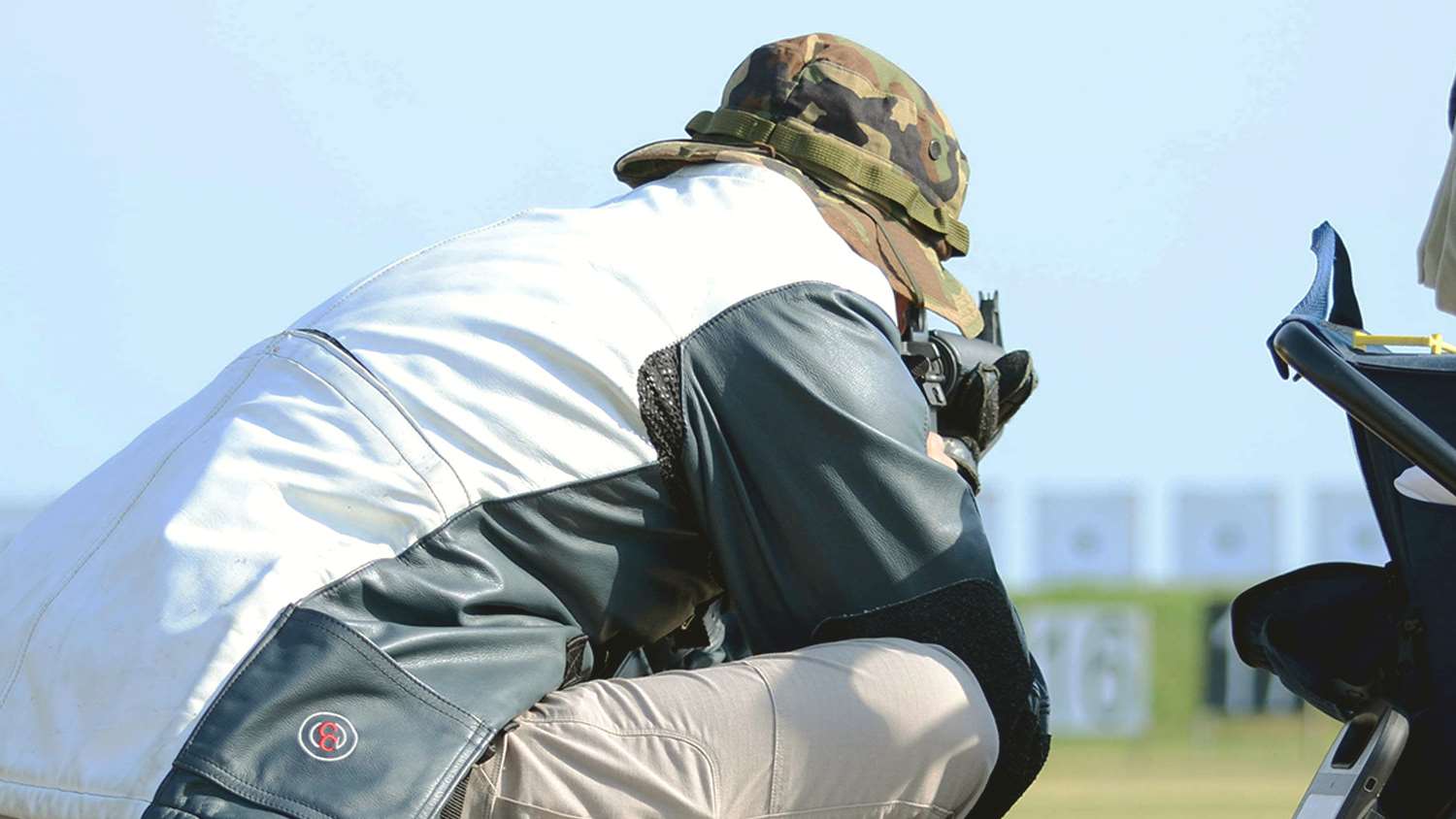 A rapid fire competitor sends one of 10 rounds downrange in the sitting stage of an EIC Rifle Match