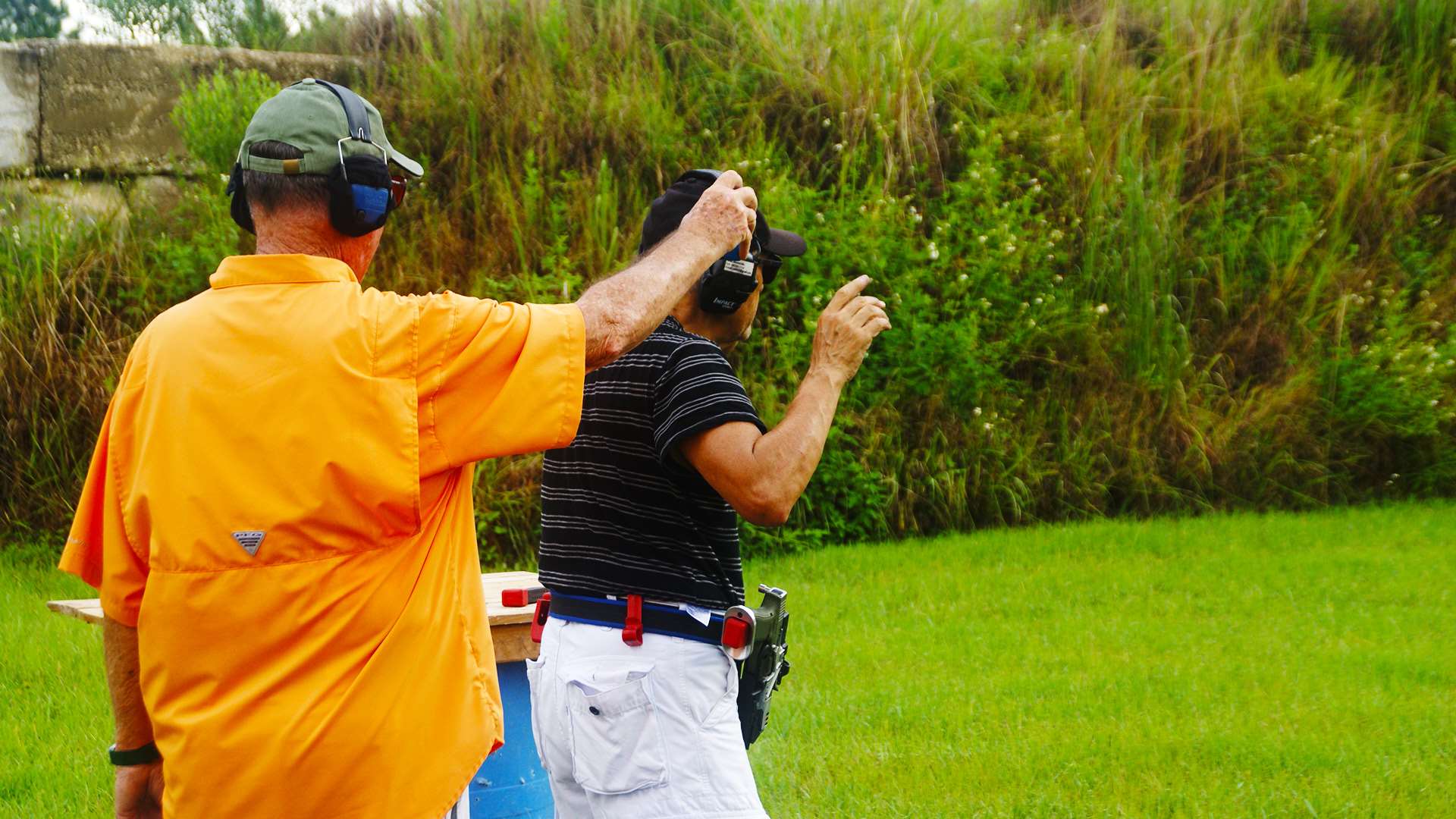 Steel challenge centerfire pistol competitor prepares to fire