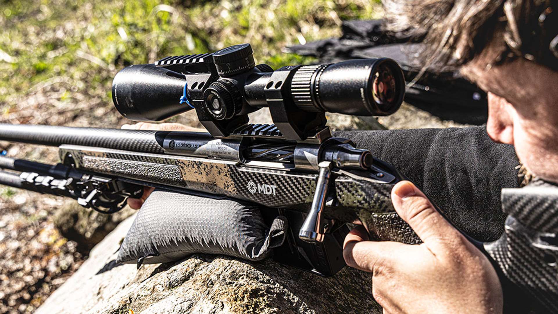 Shooter with a MDT CRBN Remington 700 left-handed rifle stock