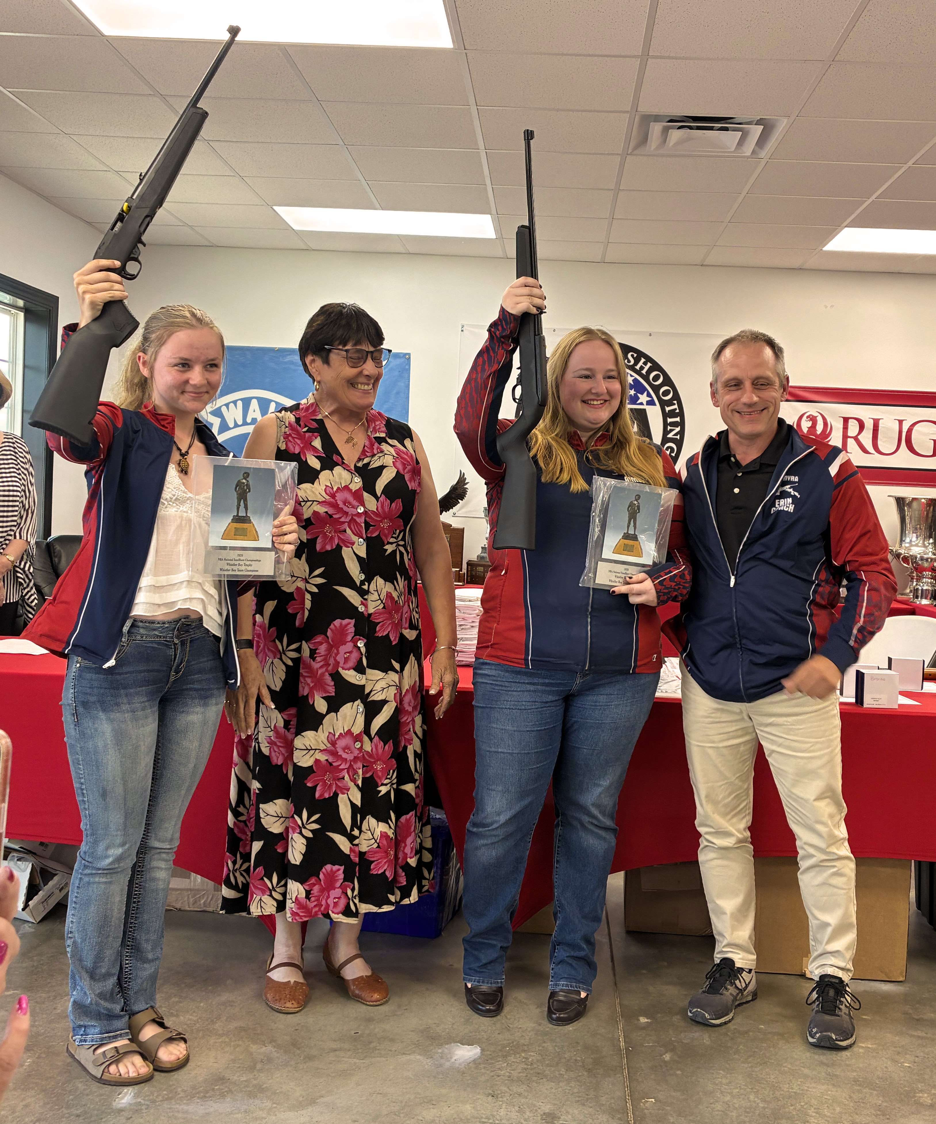 Gianna Albright and Aimee Ridinger holding their Ruger 10/22 rifle in the air after winning the 2026 Whistler Boy match