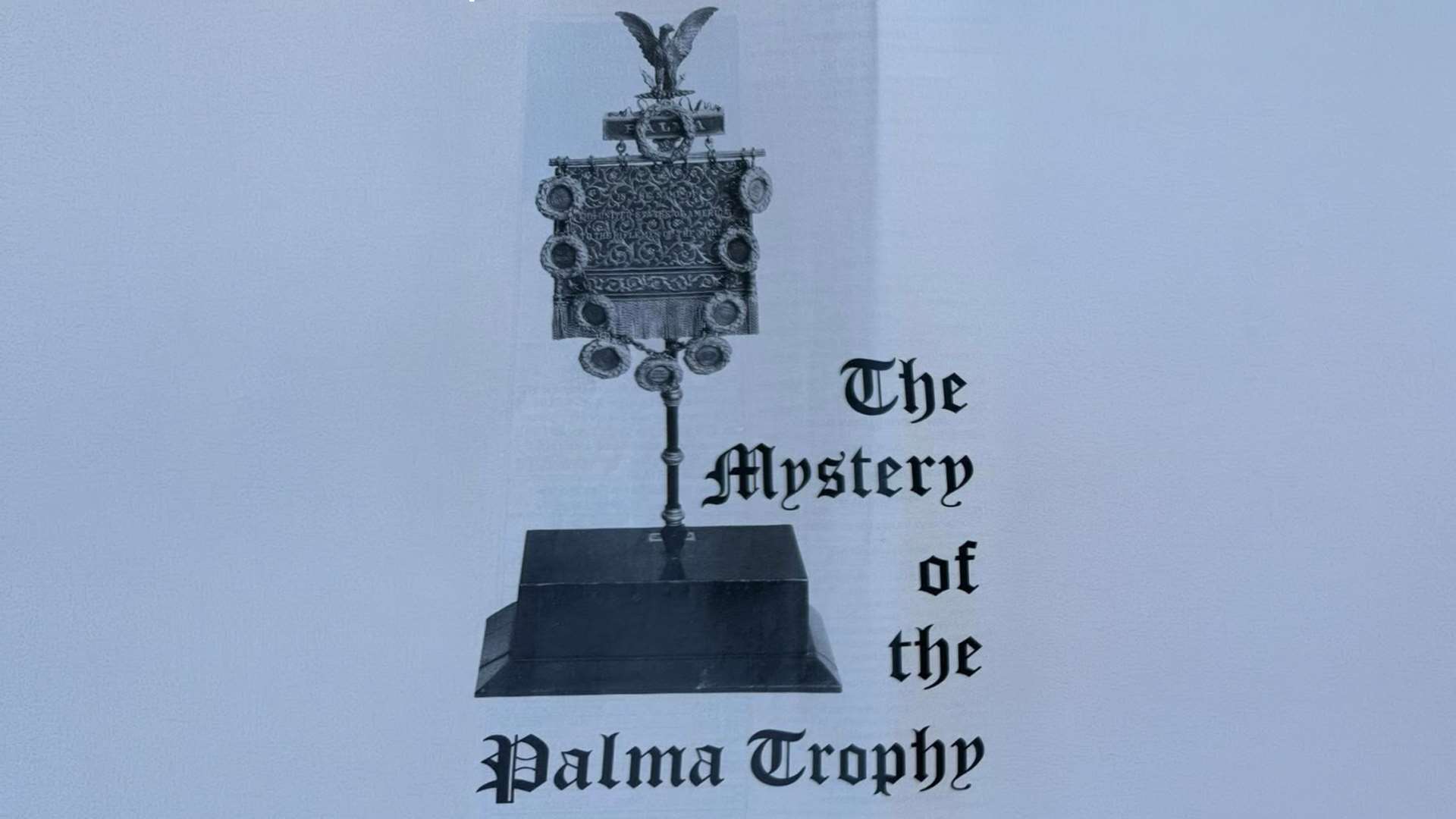 Black and white photograph of the complete Palma Trophy mounted on its tall pedestal standard