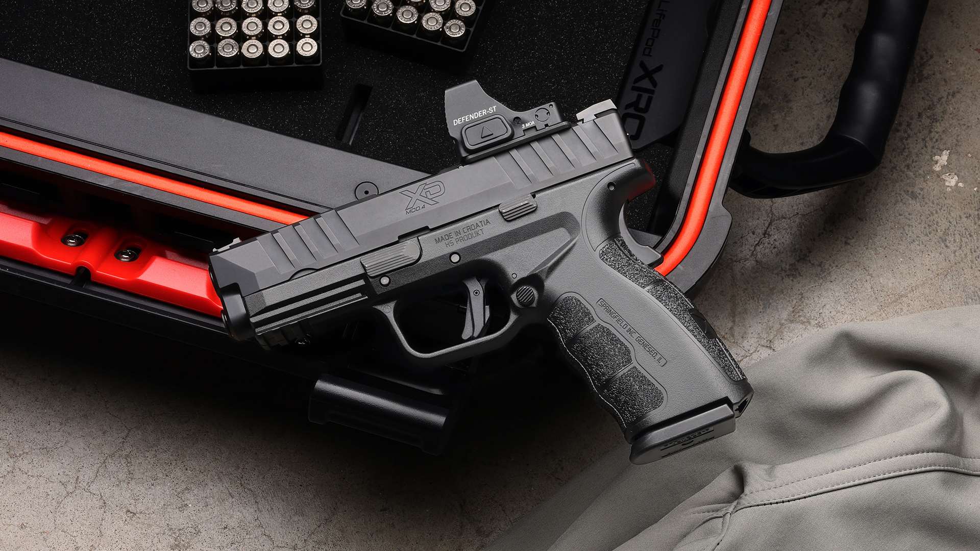 Springfield Armory XD Mod.4 OSP slide showing deep serrations optics mounting cut and aggressive polymer frame texture