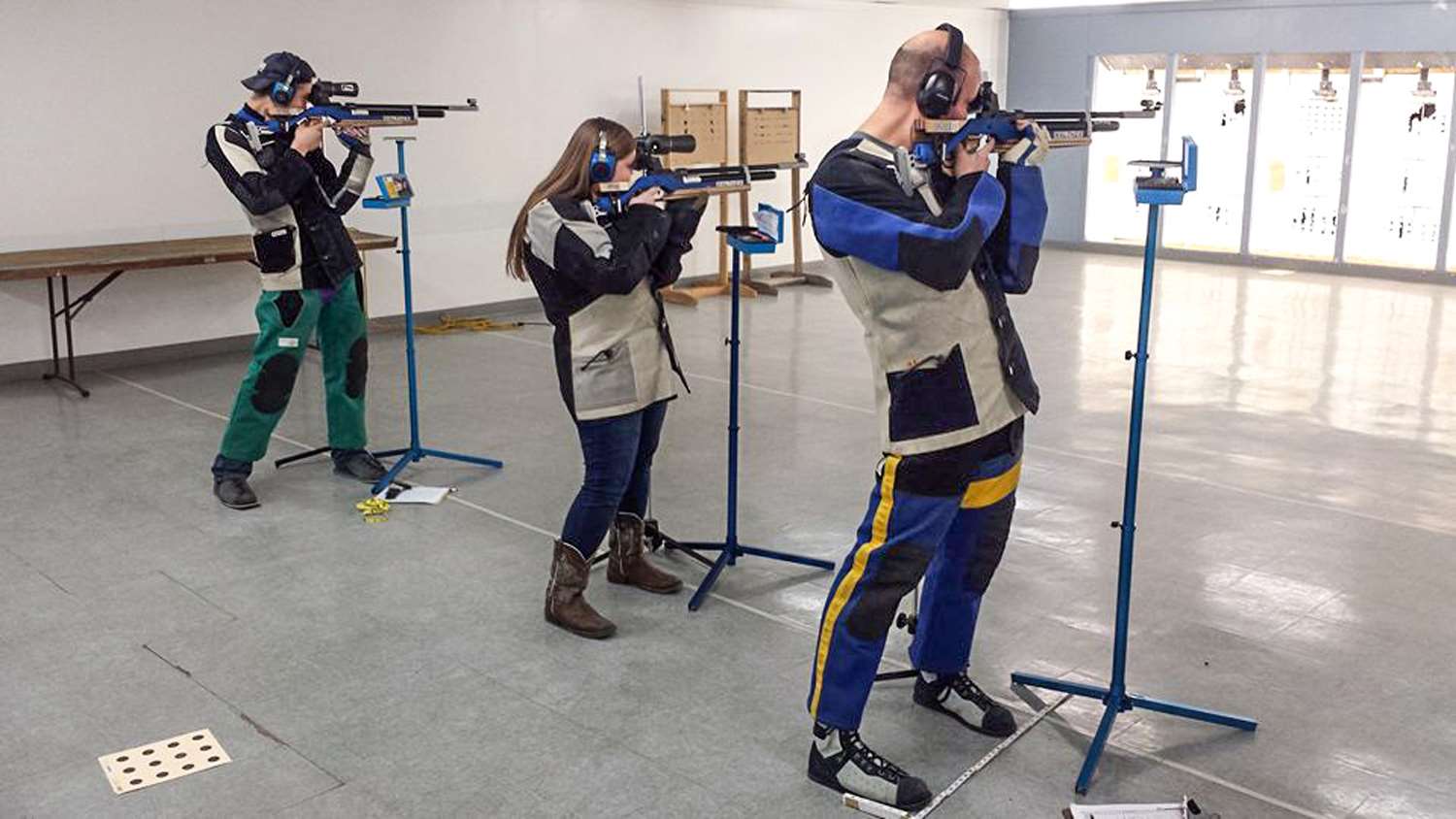 Collegiate competitors at the Michigan State Indoor Metric 3-Position Smallbore Championship.