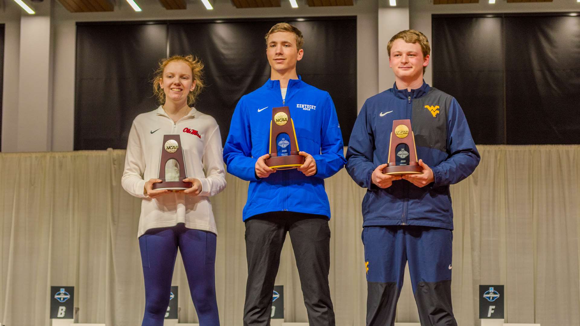Audrey Gogniat, Braden Peiser and Griffin Lake on 2026 NCAA smallbore rifle podium