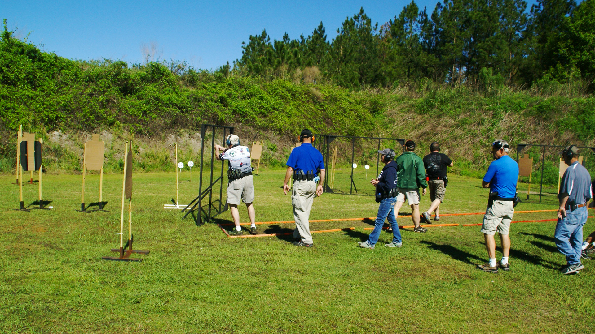 Shooters in between stages at a USPSA match