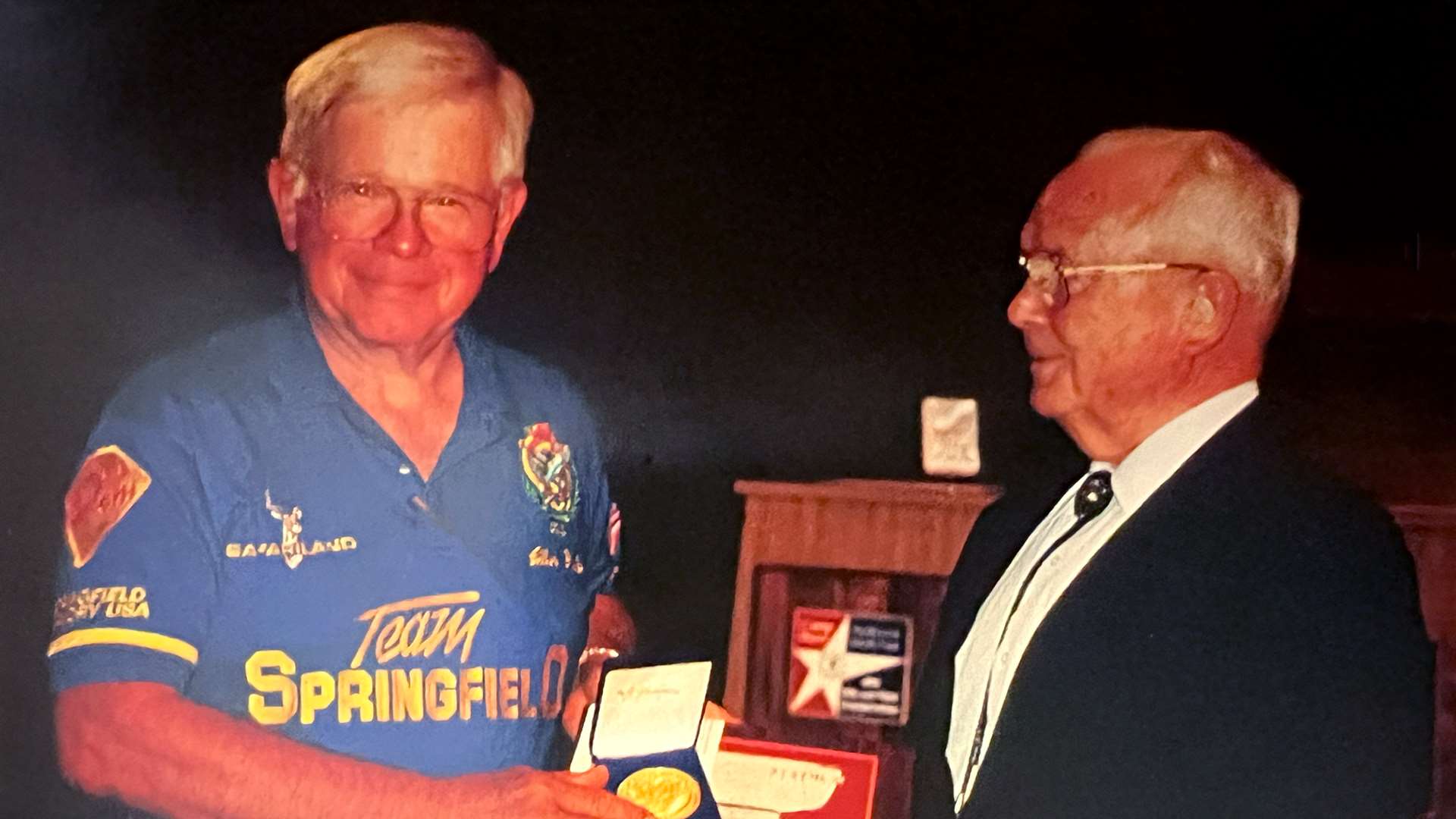 Allan Fulford receiving an award from Col. Walter Walsh at Camp Perry during the 1990 NRA National Championships
