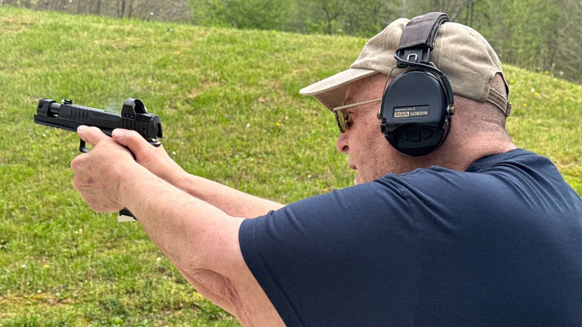 Shooter firing the SIG Sauer P211-GTO