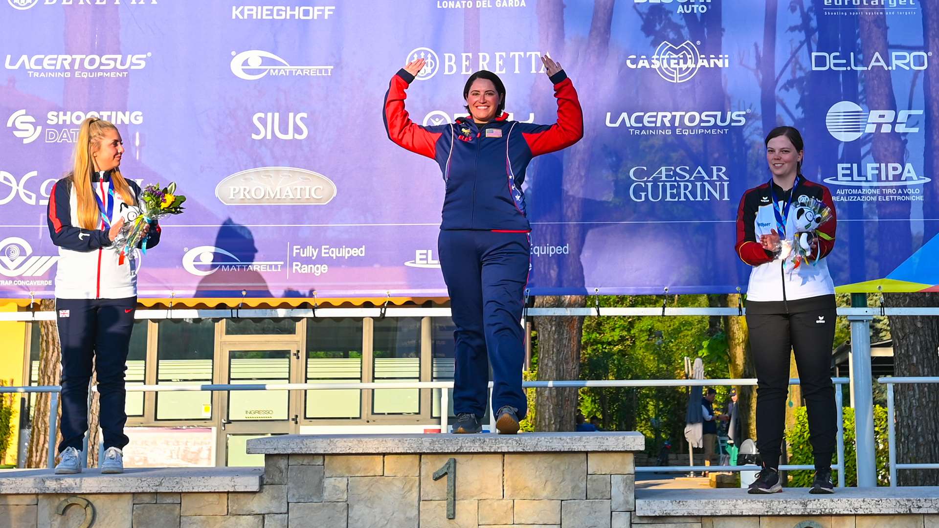 Caitlin Connor stands center podium in Italy