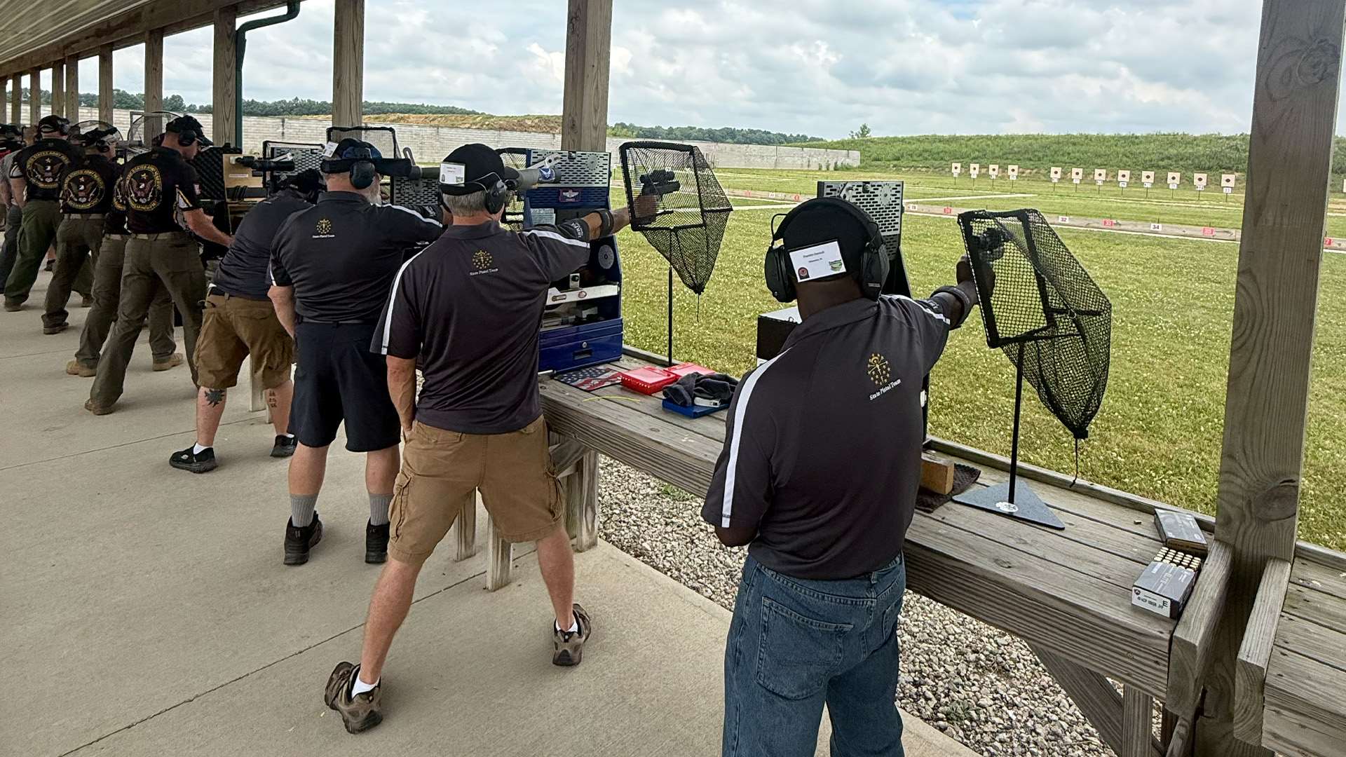 Franklin Dessuit in the foreground on the pistol line with ISRPA Blue teammates during the State Association Team Match