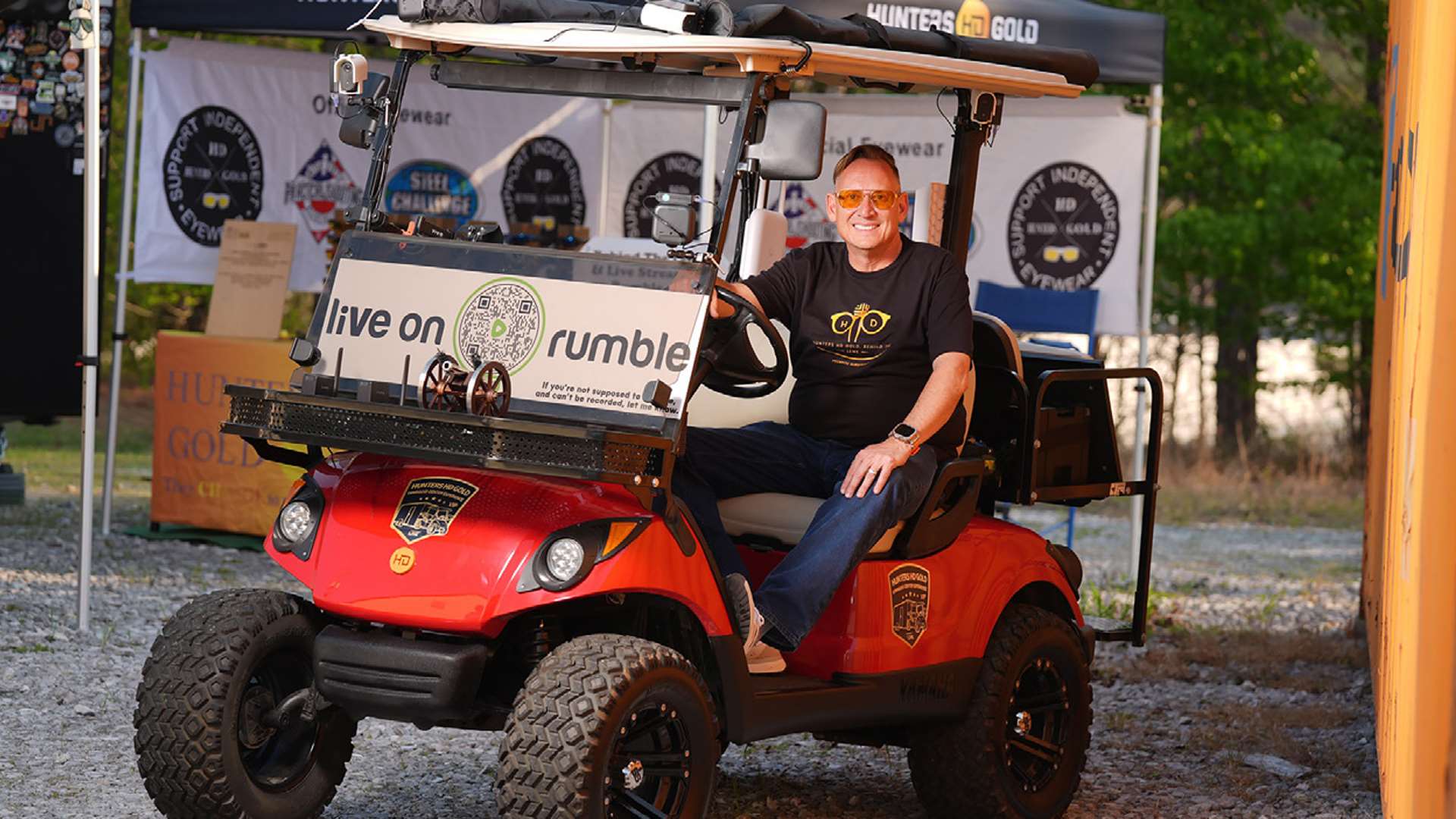 Brian Conley in the Hunters HD Gold livestreaming capable golf cart at a USPSA match