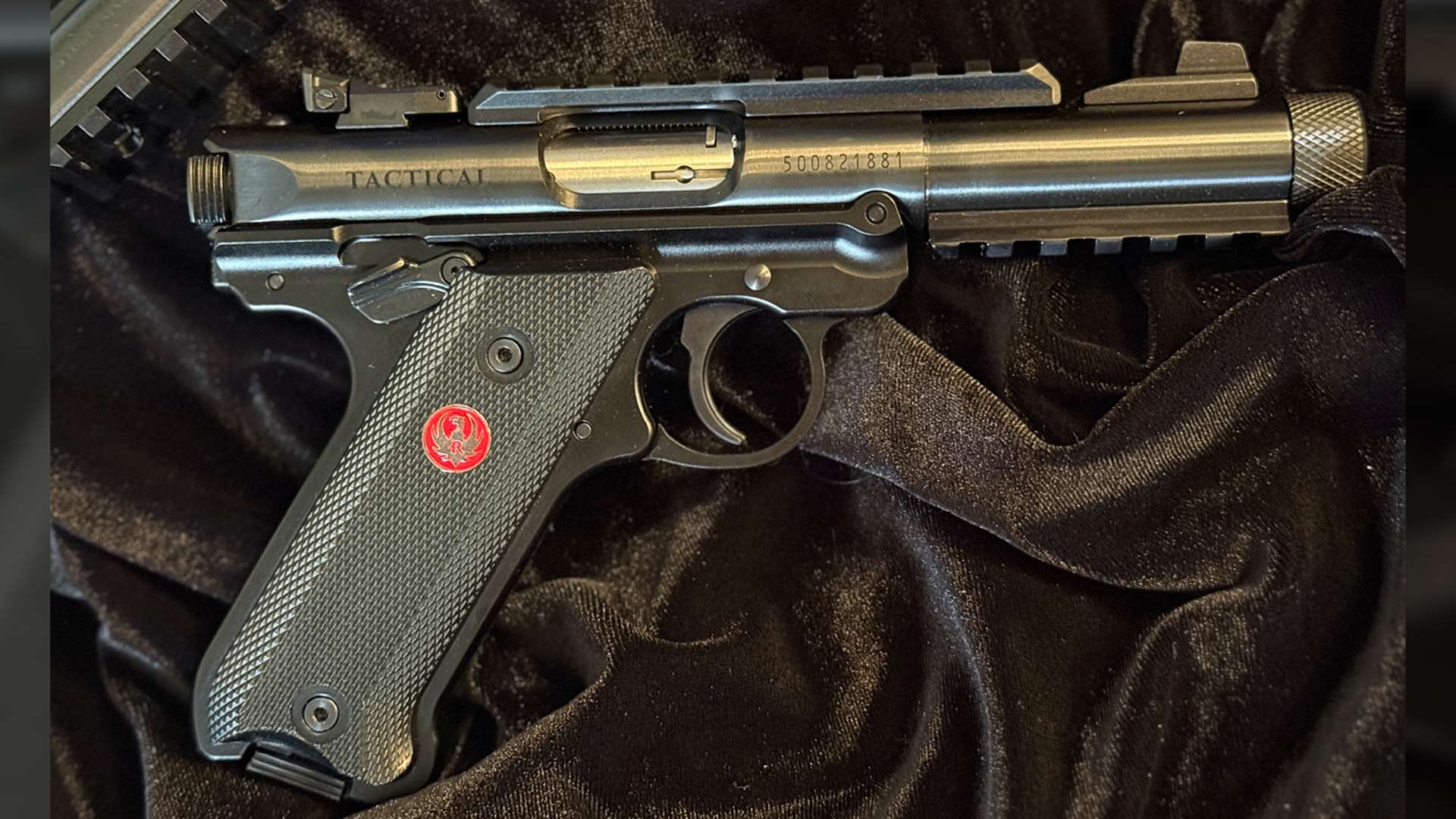 Stock Ruger Mark IV Tactical pistol on velvet background