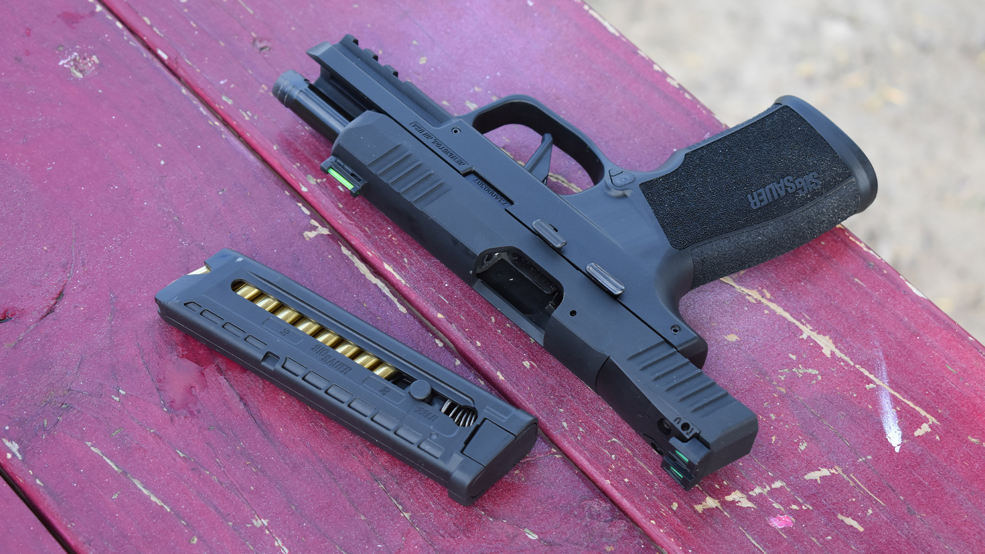 SIG rimfire pistol and magazine