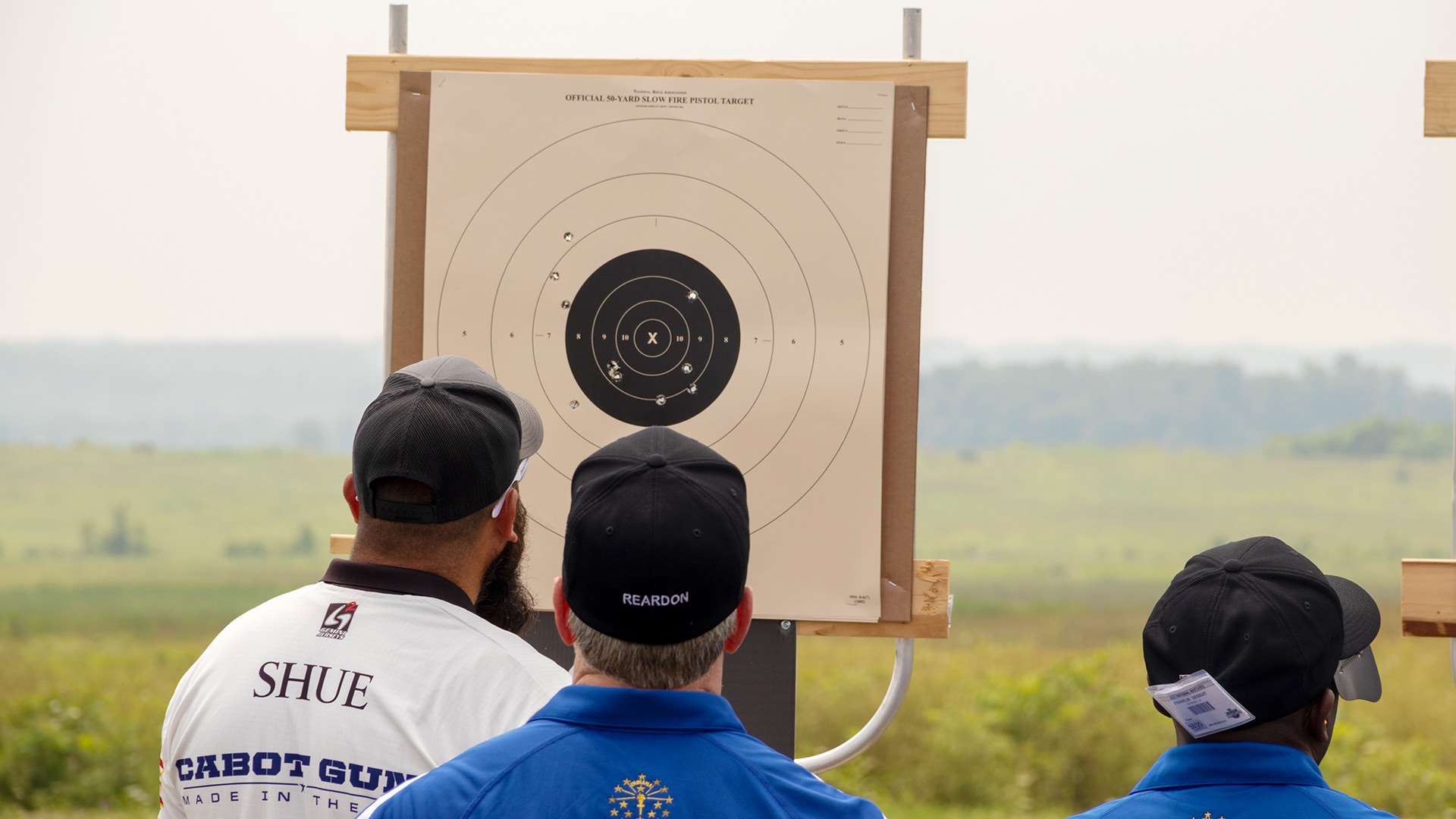 Jon Shue and pistol target