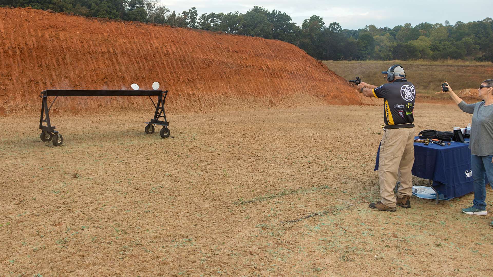 Jerry Miculek shooting at a steel plate rack