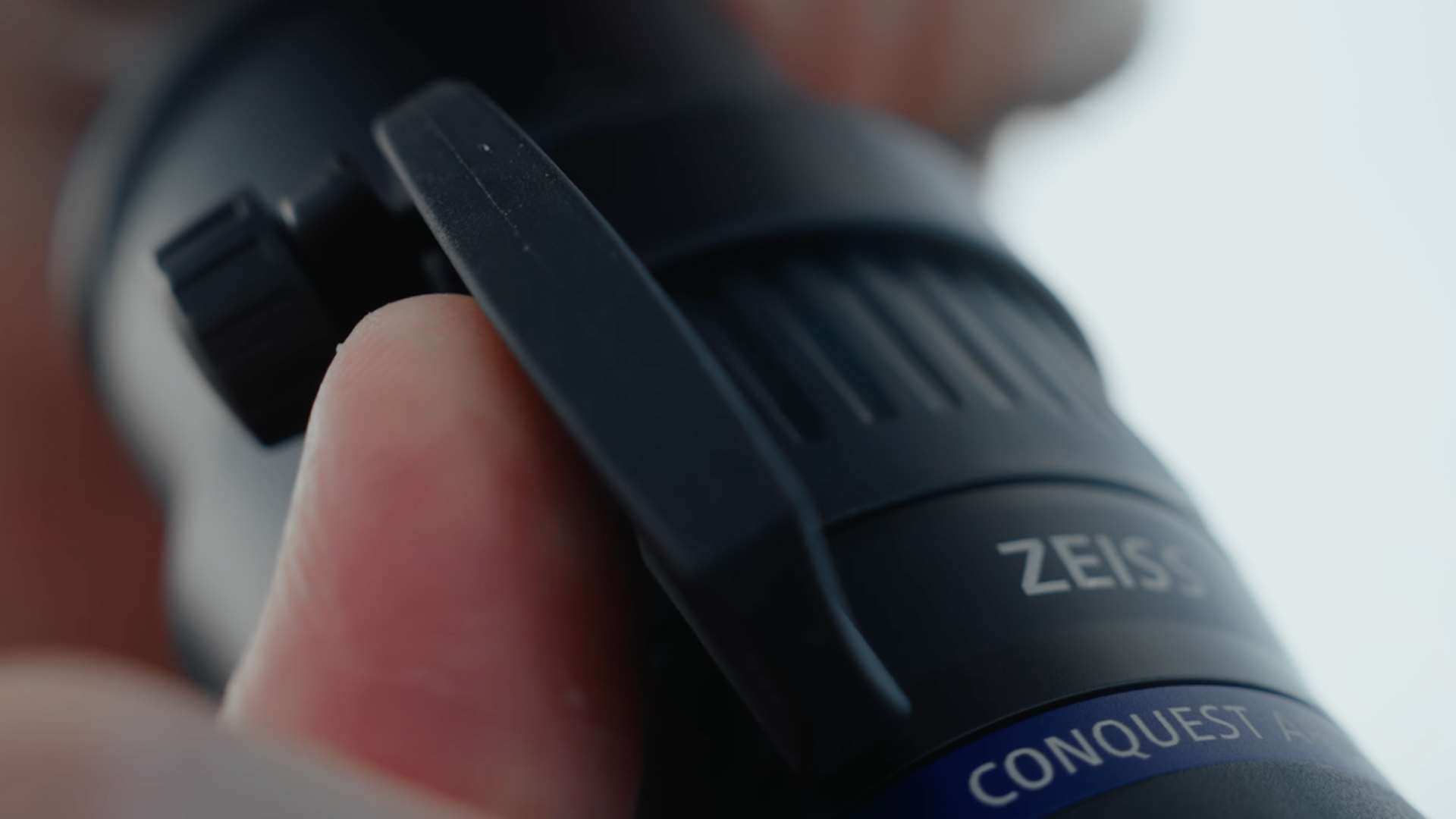 Close-up of the compact throw lever on the Zeiss Conquest Apia 65 used for magnification adjustment