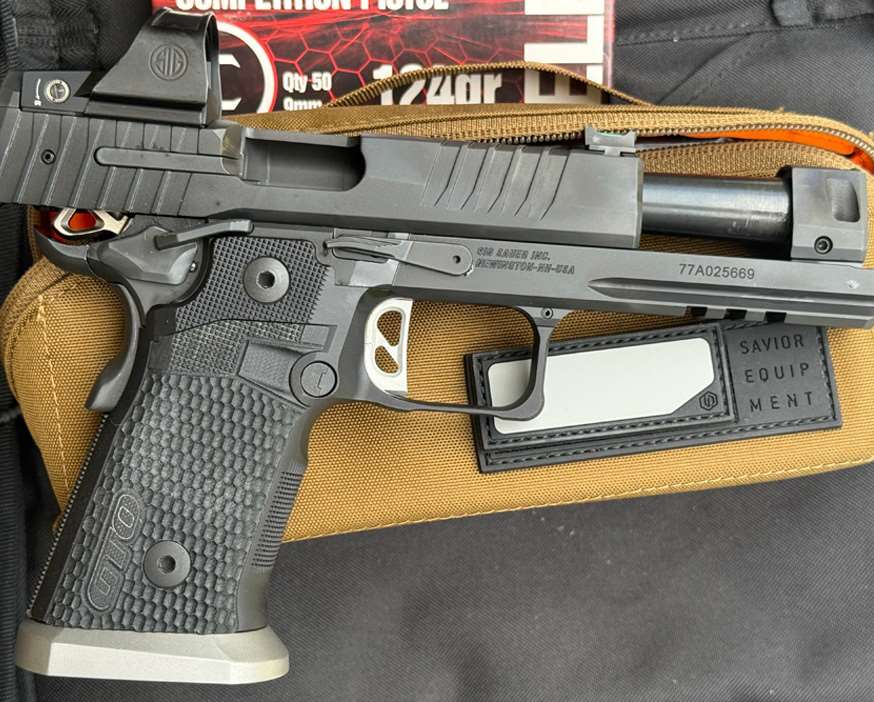 SIG P211-GTO handgun with slide locked back