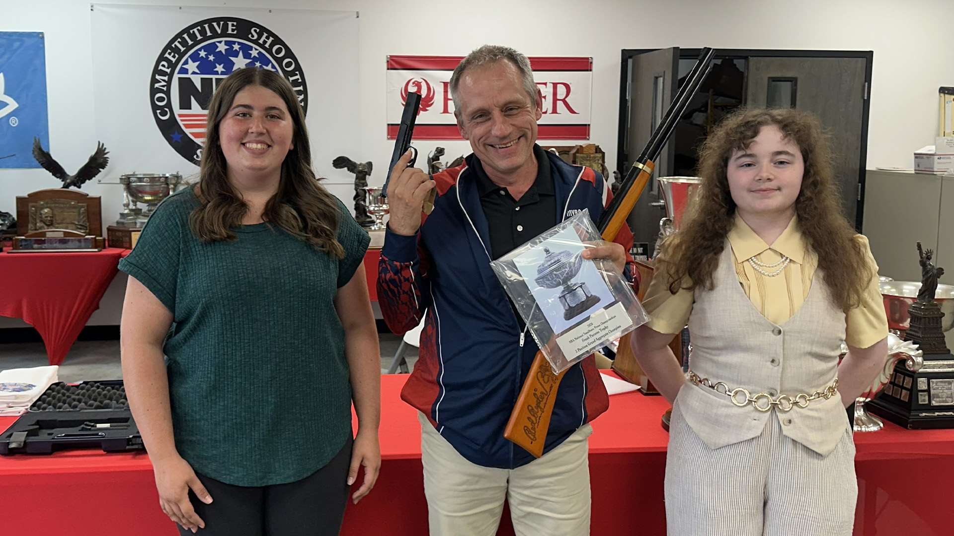 Avery Hines, Erin Gestl and Ruby Harris as the top three in the Smallbore Three-Position grand aggregate