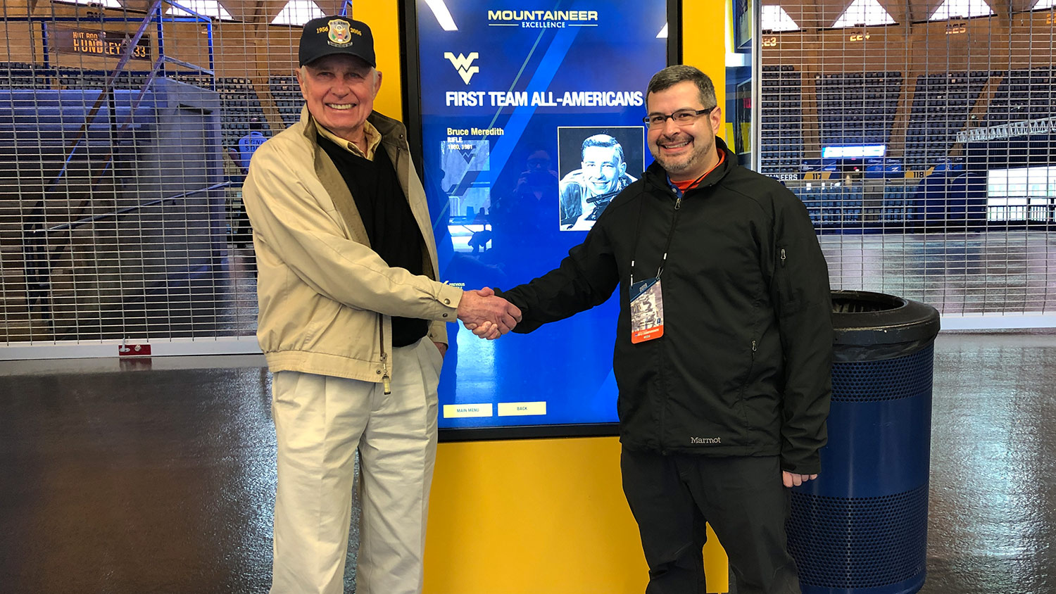 Bruce Meredith and John Parker, WVU alumni at 2019 NCAA Rifle Championship at the WVU Coliseum.