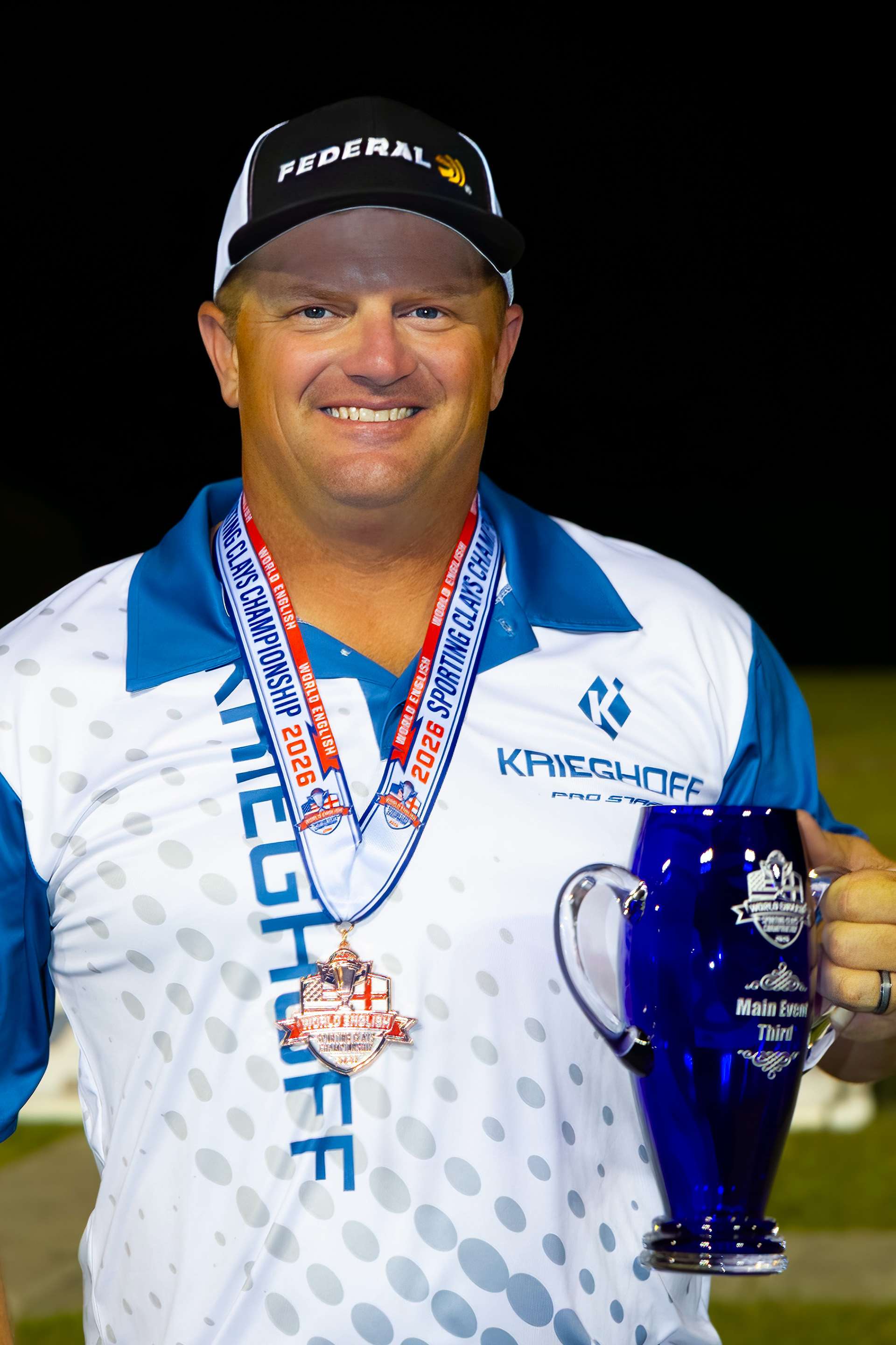 Derrick Mein holding his third place trophy at 2026 World English Sporting Clays Championship