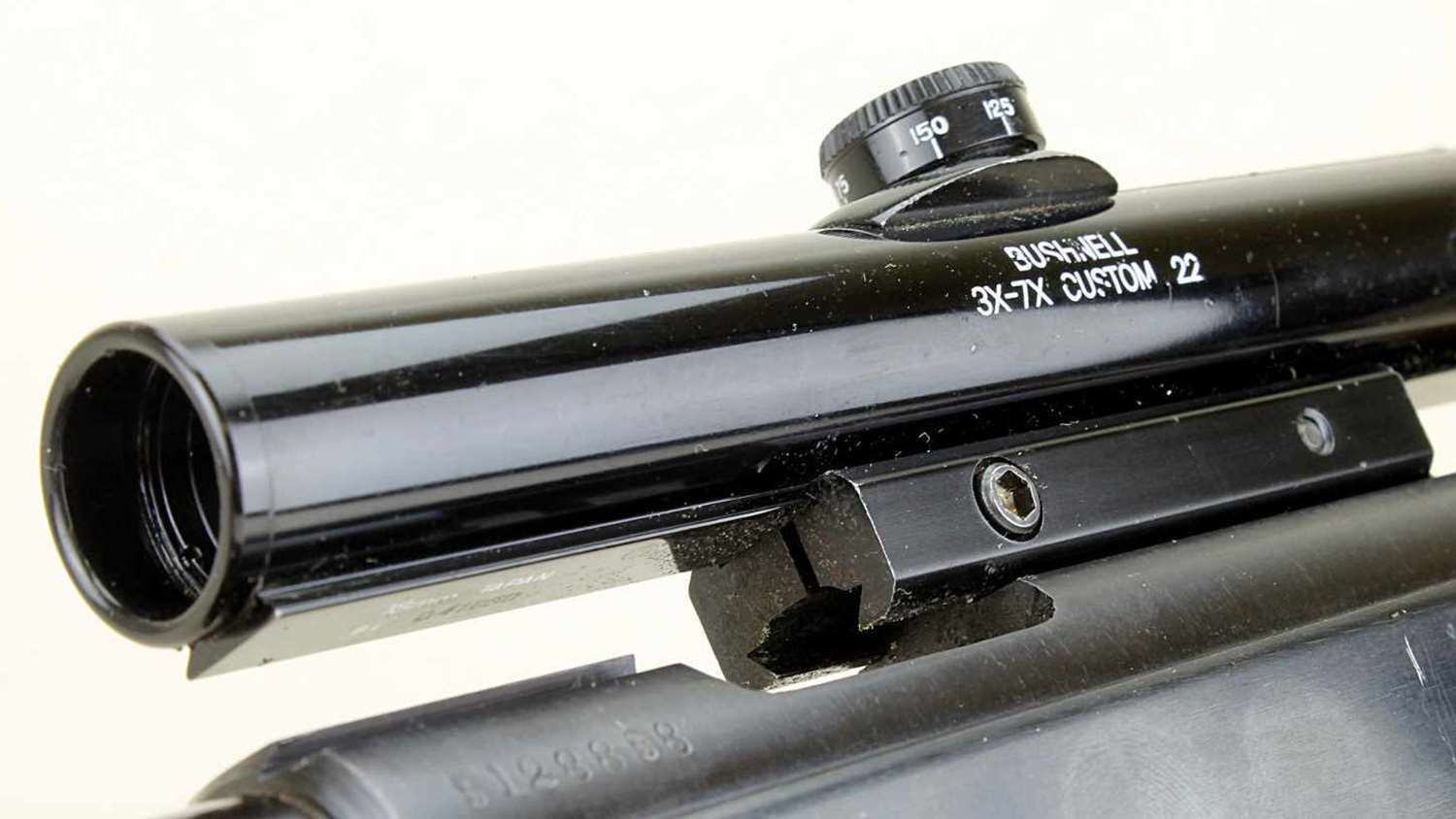 Mossberg’s tip-off concept spawned some new ideas, such as this Bushnell scope with a dovetail rail that mirrors a .22’s receiver grooves. A special mount sinks “claws” into both the scope rail and the receiver grooves