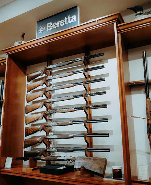 Interior of Cole Fine Guns and Gunsmithing showing premium Beretta shotguns
