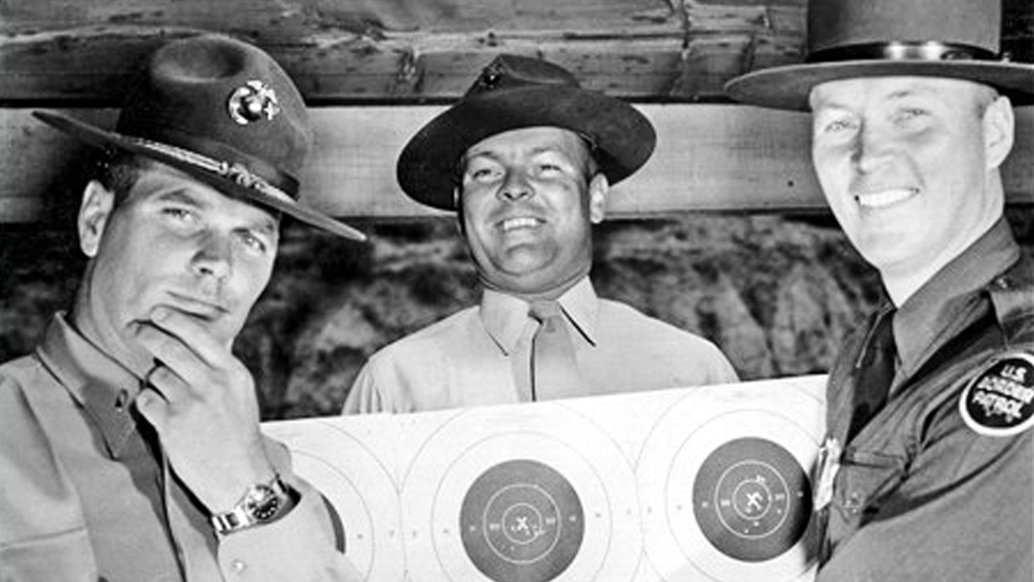 Elmer Hilden examines a Bullseye target in 1957.