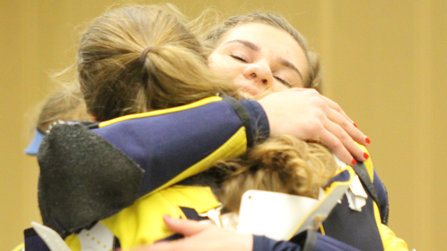 Elizabeth Marsh and Morgan Phillips embrace after the match