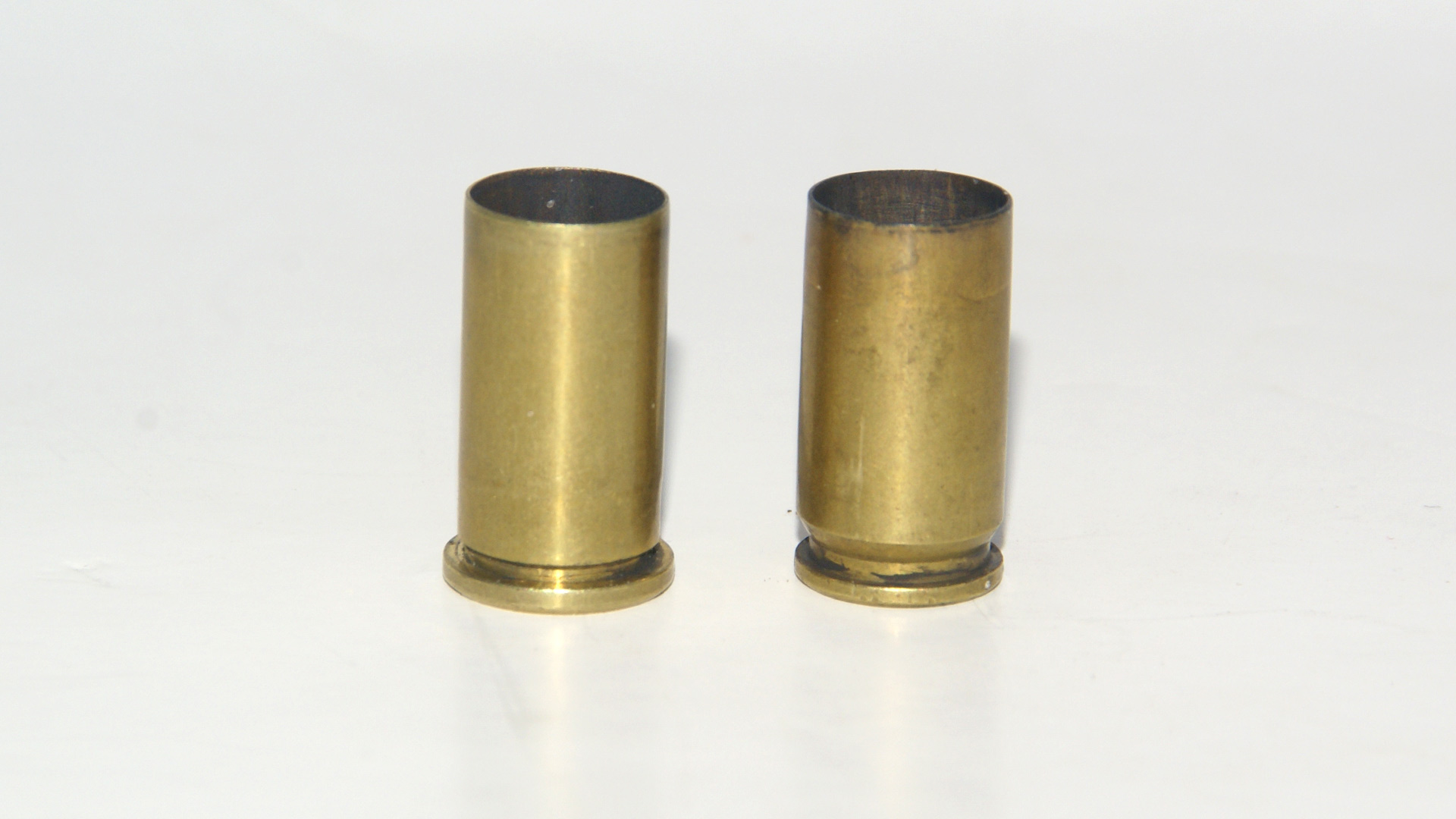 .38 Short Colt and 9mm Luger cases, side-by-side