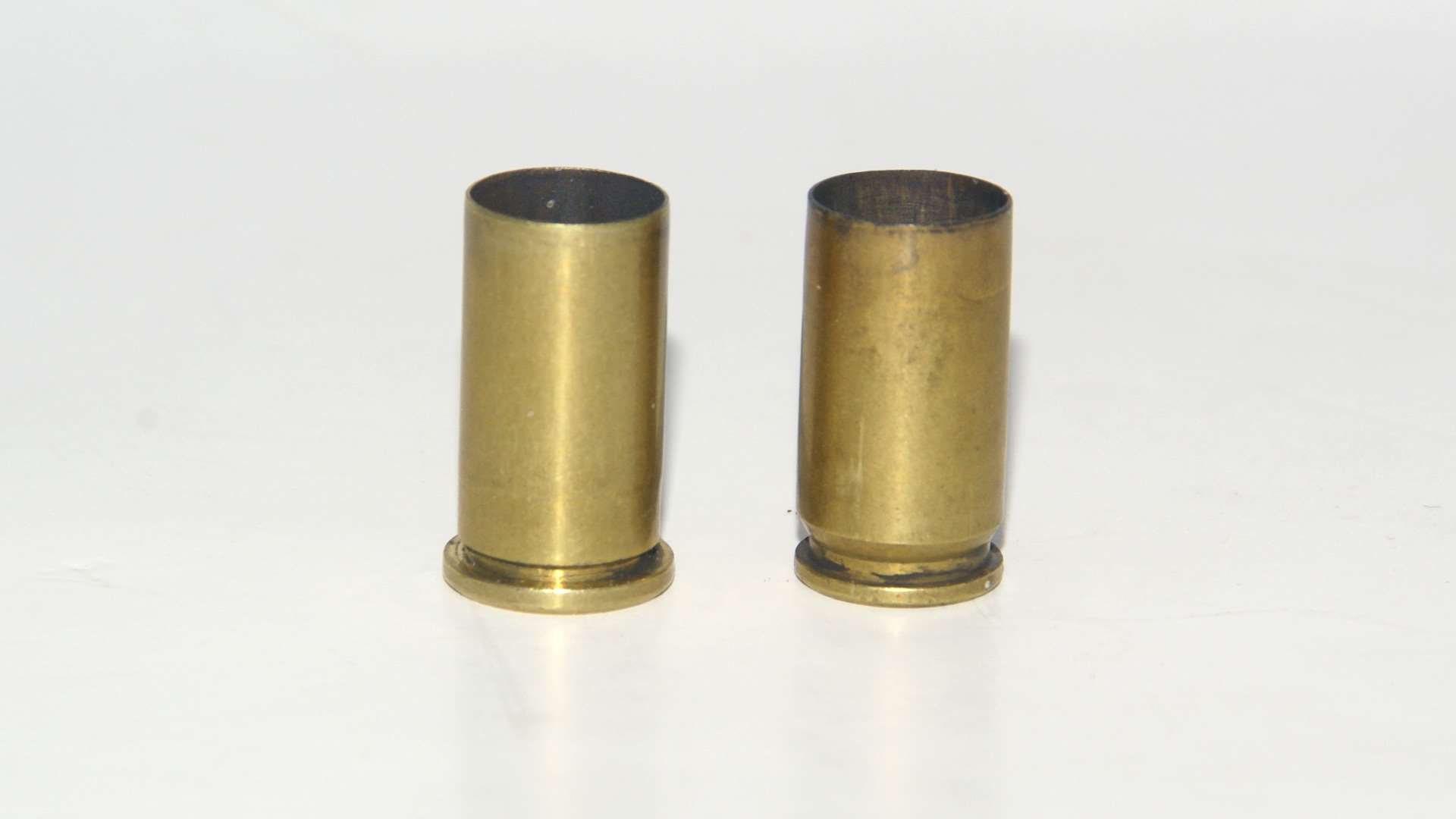 .38 Short Colt and 9mm Luger cases, side-by-side