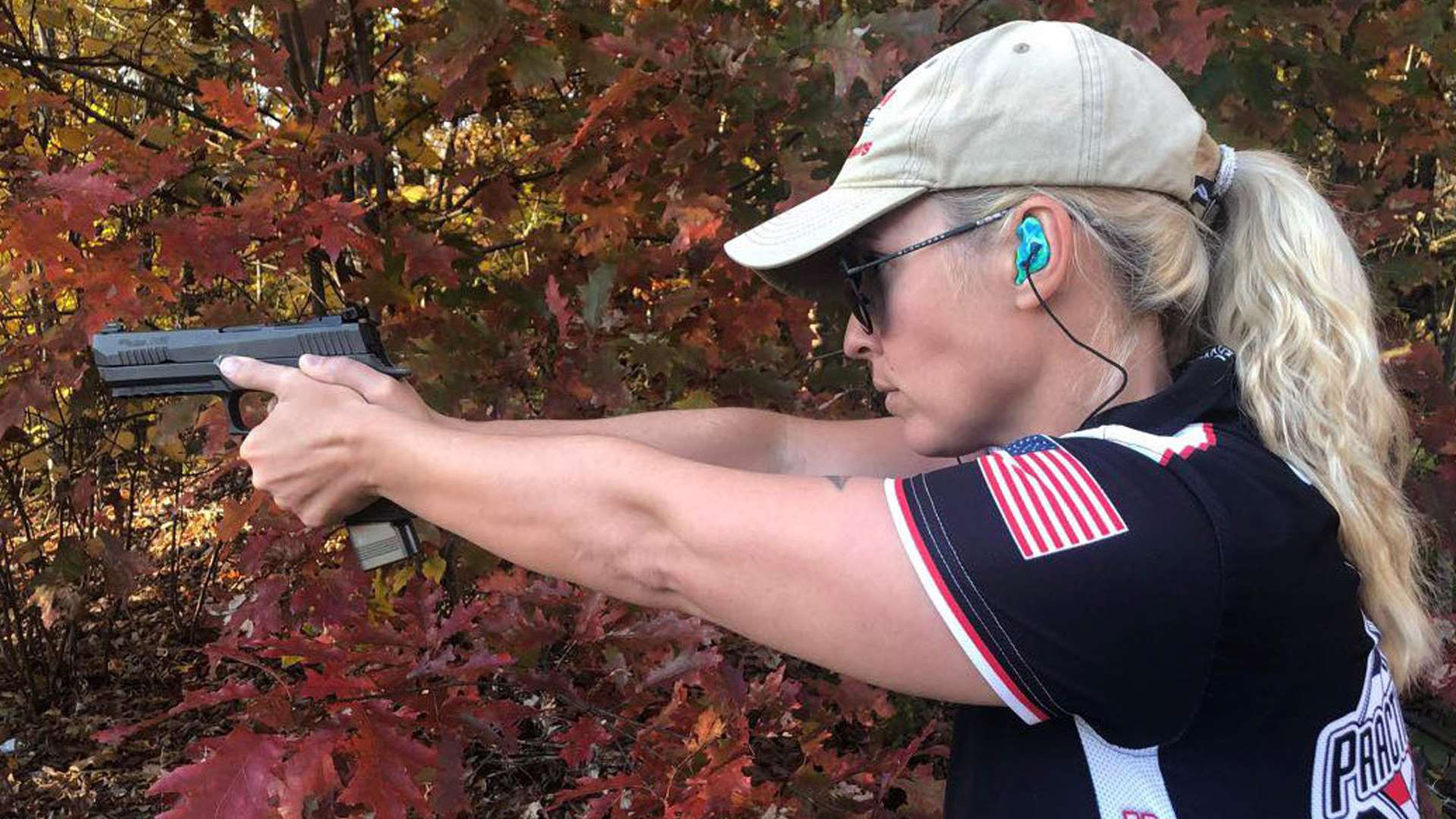 Linda Pool shooting a pistol
