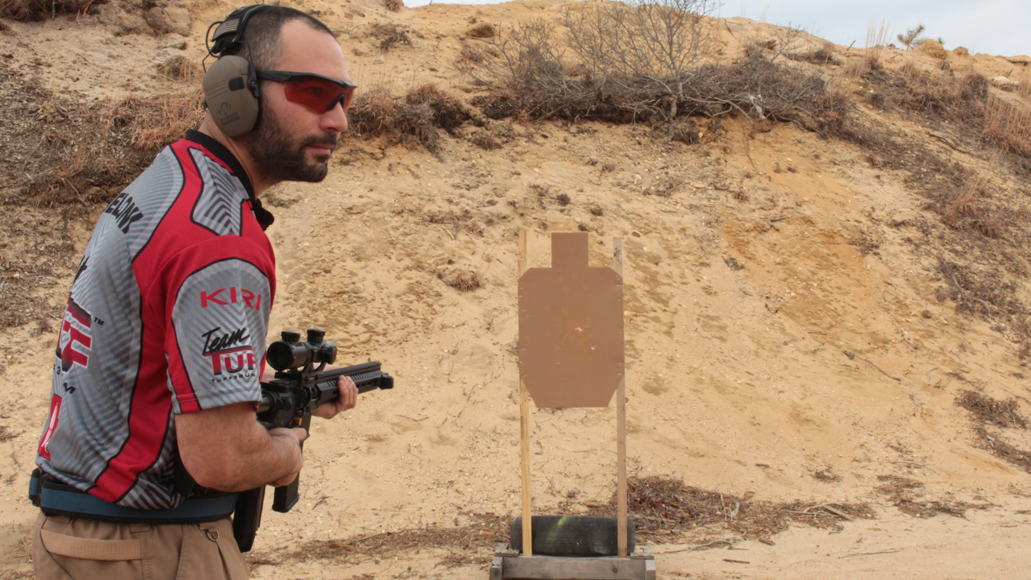 Using a laser lets you setup on one target, while being in positon to quickly engage another. If you practice enough you can get two shots off during the start tone. Here the author uses a Crimson Trace CMR-201 Rail Master to start the party.